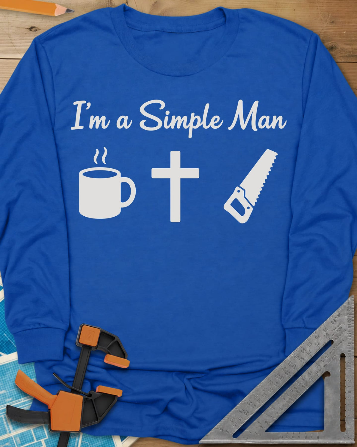 I’m A Simple Man Christian Woodworking long sleeve shirt in Royal, script headline above a steaming coffee mug, a cross and