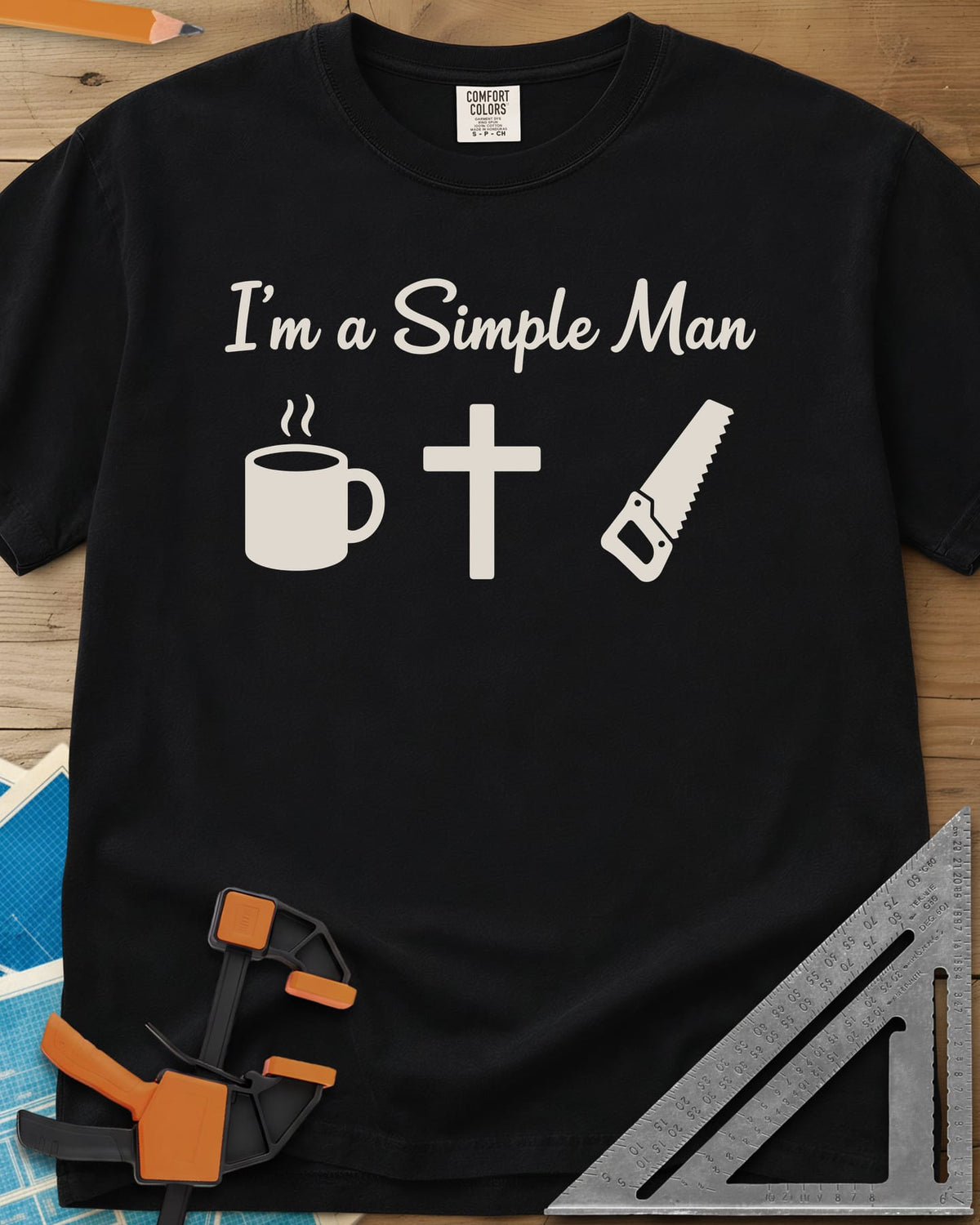 I’m A Simple Man Christian Woodworking heavyweight tee in Black, script headline above a steaming coffee mug, a cross and a