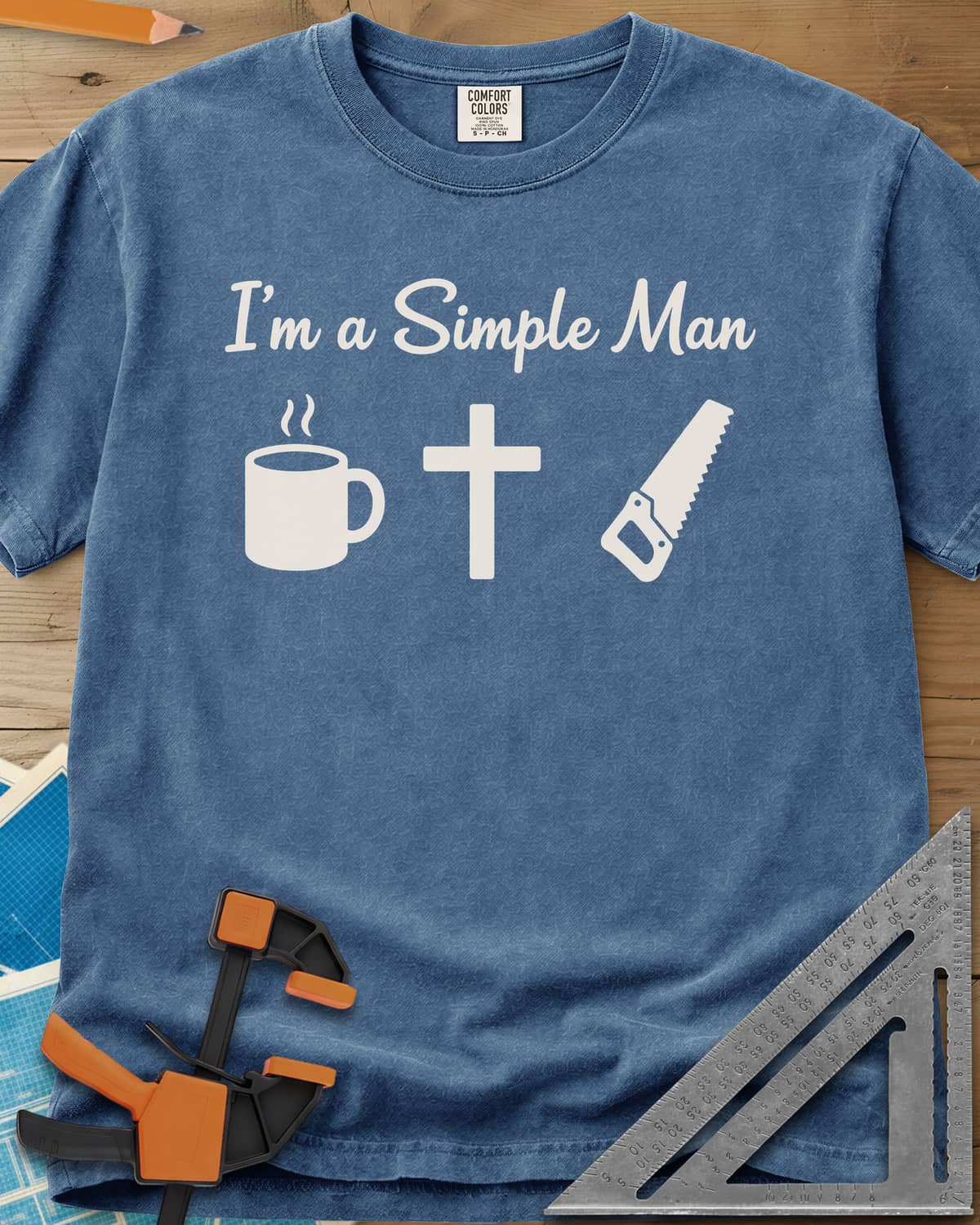 I’m A Simple Man Christian Woodworking heavyweight tee in Blue Jean, script headline above a steaming coffee mug, a cross