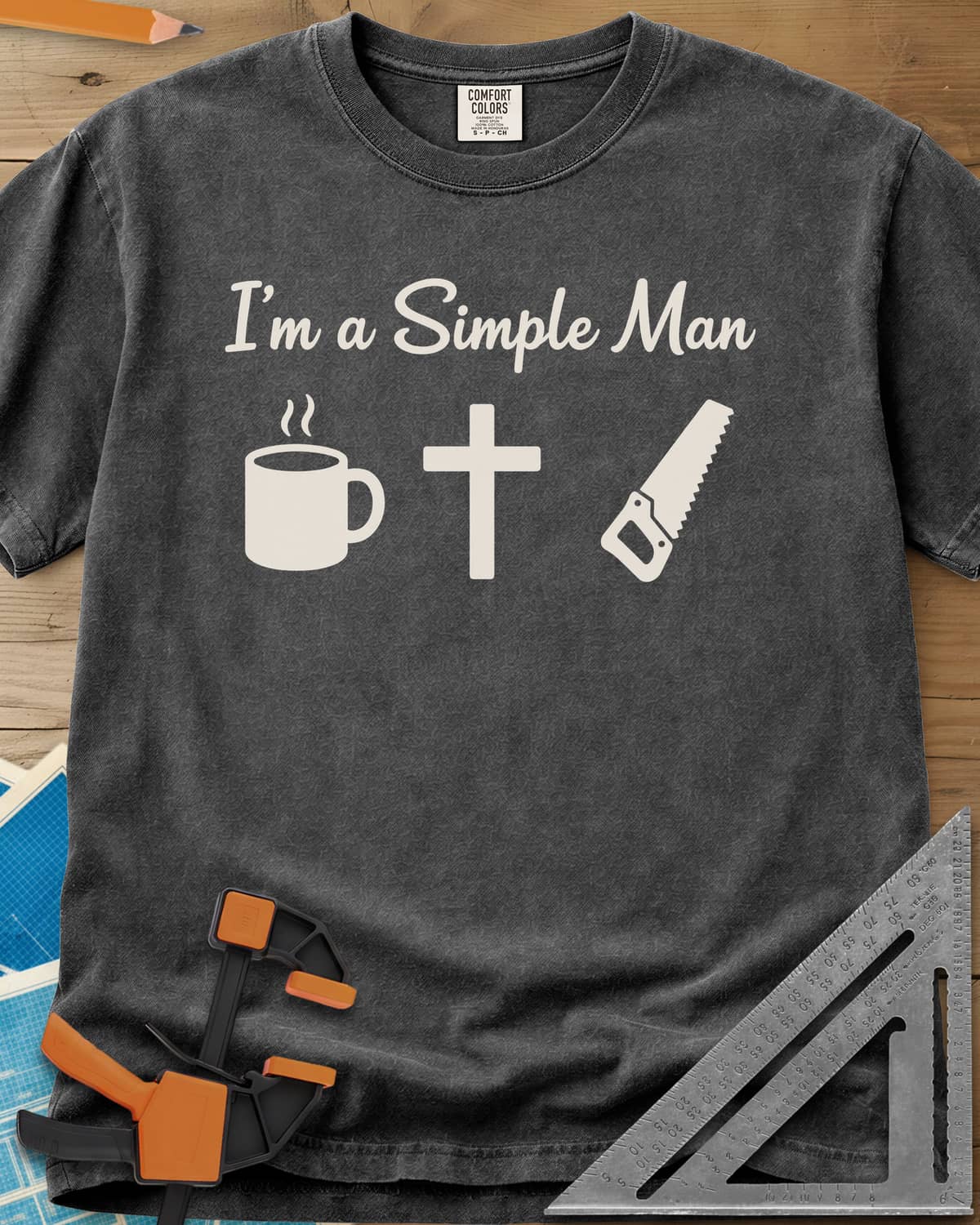 I’m A Simple Man Christian Woodworking heavyweight tee in Pepper, script headline above a steaming coffee mug, a cross and a