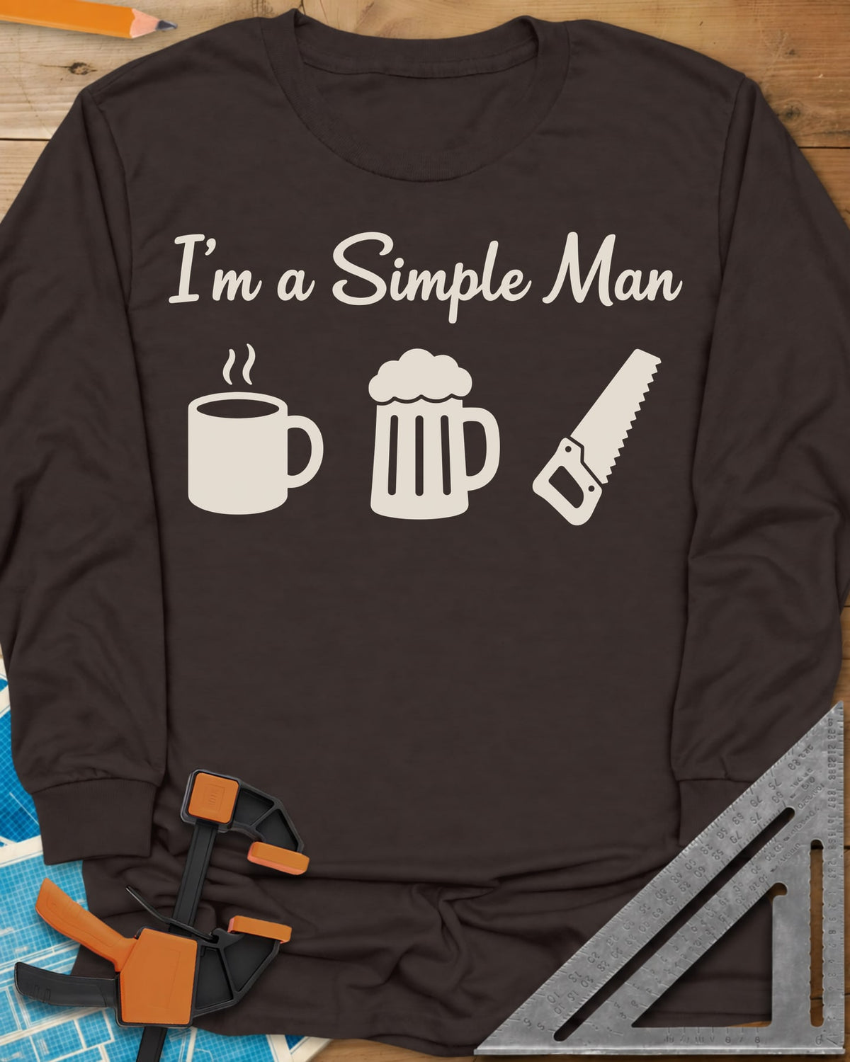 I’m A Simple Man Woodworking long sleeve shirt in Dark Chocolate, script headline over a steaming coffee mug, a beer mug and