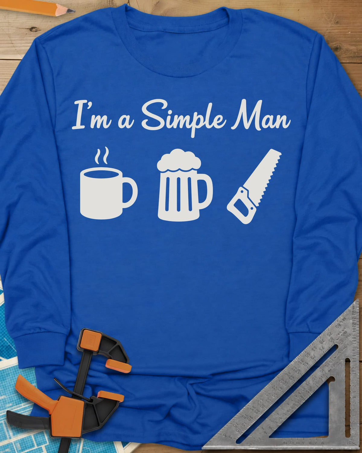 I’m A Simple Man Woodworking long sleeve shirt in Royal, script headline over a steaming coffee mug, a beer mug and a handsaw