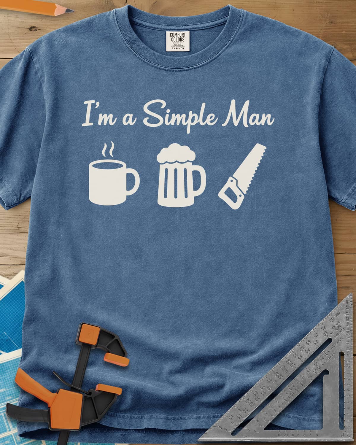I’m A Simple Man Woodworking heavyweight tee in Blue Jean, script headline over a steaming coffee mug, a beer mug and a
