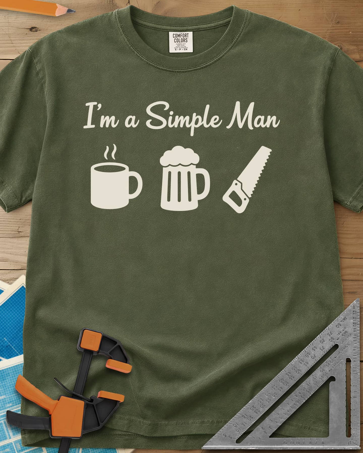 I’m A Simple Man Woodworking heavyweight tee in Hemp, script headline over a steaming coffee mug, a beer mug and a handsaw