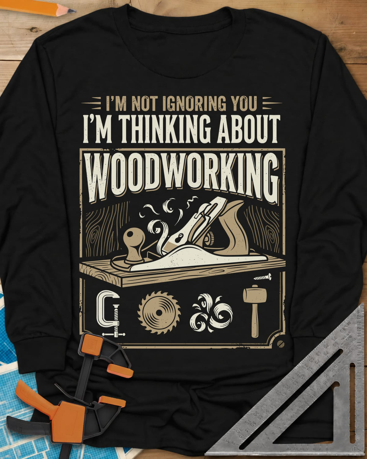 I'm Not Ignoring You I'm Thinking About Woodworking long sleeve shirt in Black, a framed hand plane and shavings above