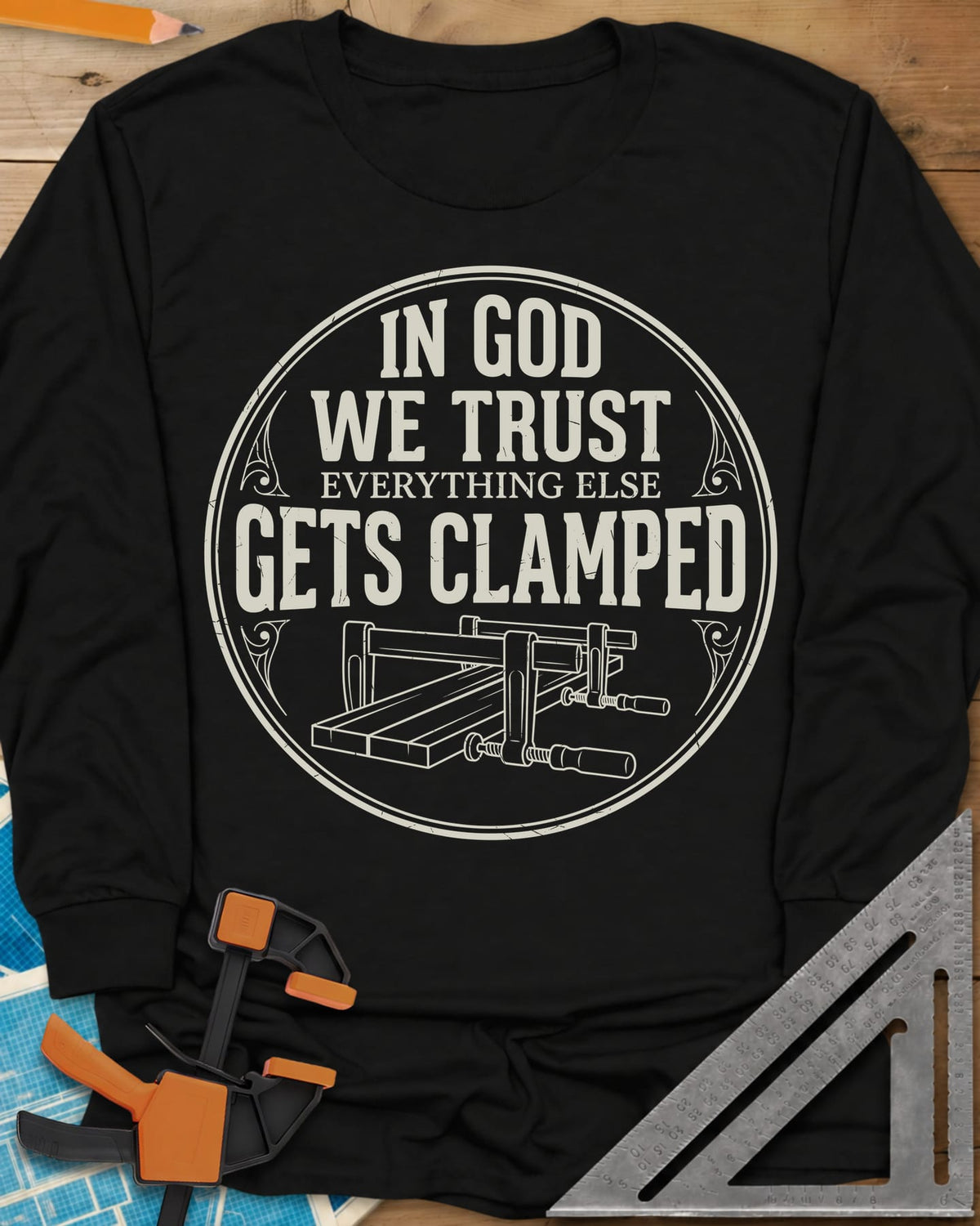 In God We Trust long sleeve shirt in Black, a round badge with two bar clamps holding boards