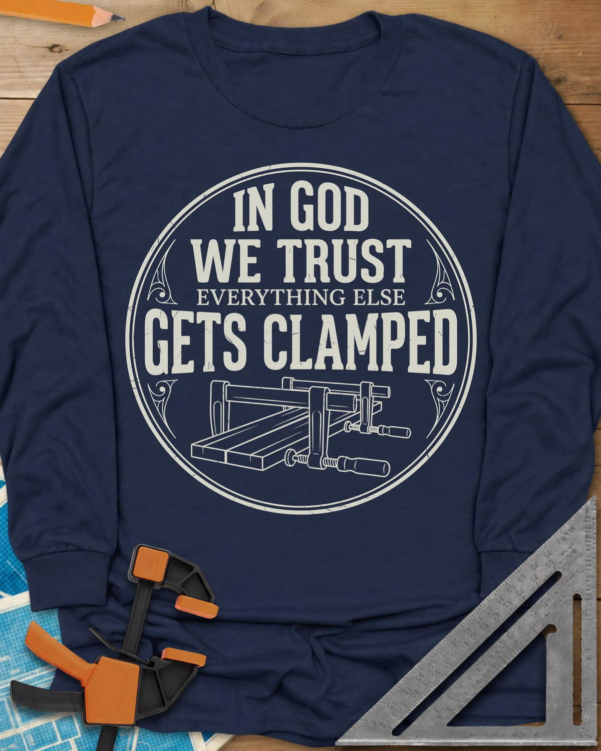 In God We Trust long sleeve shirt in Navy, a round badge with two bar clamps holding boards