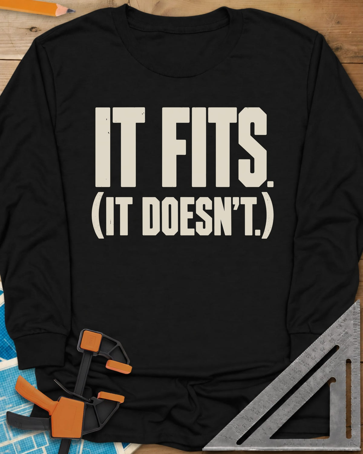 It Fits long sleeve shirt in Black, plain bold block lettering with a bracketed second line