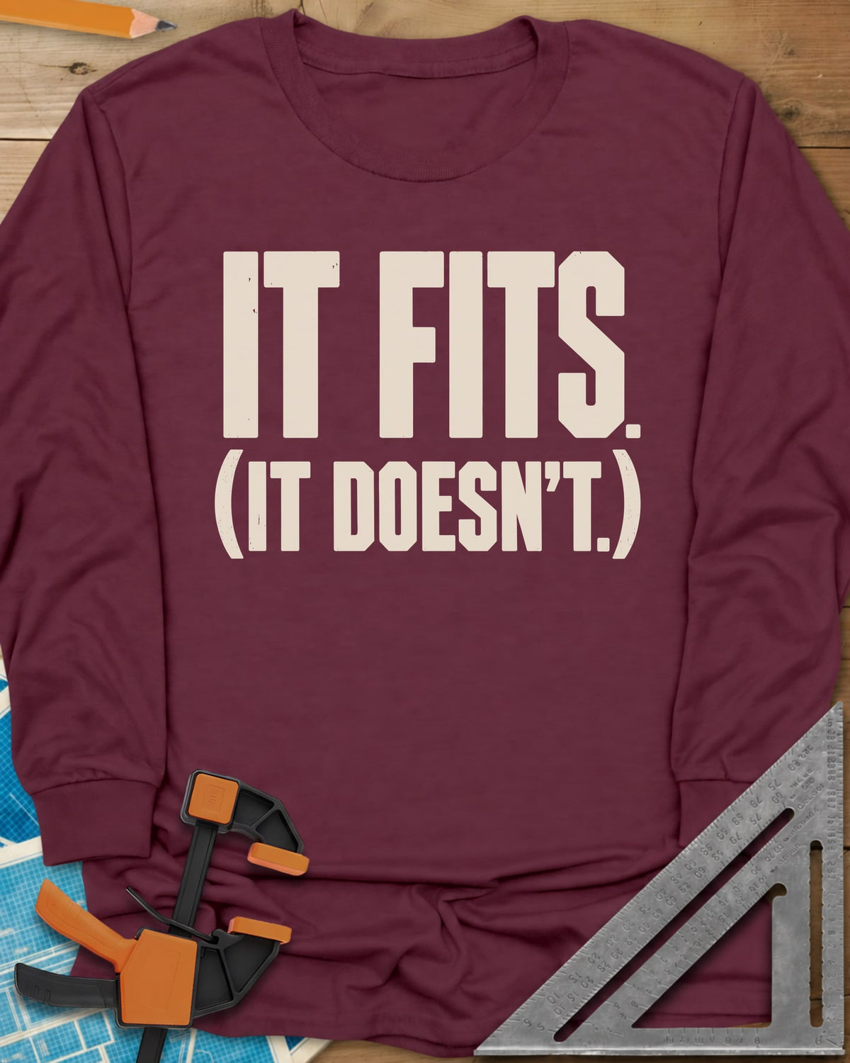 It Fits long sleeve shirt in Maroon, plain bold block lettering with a bracketed second line