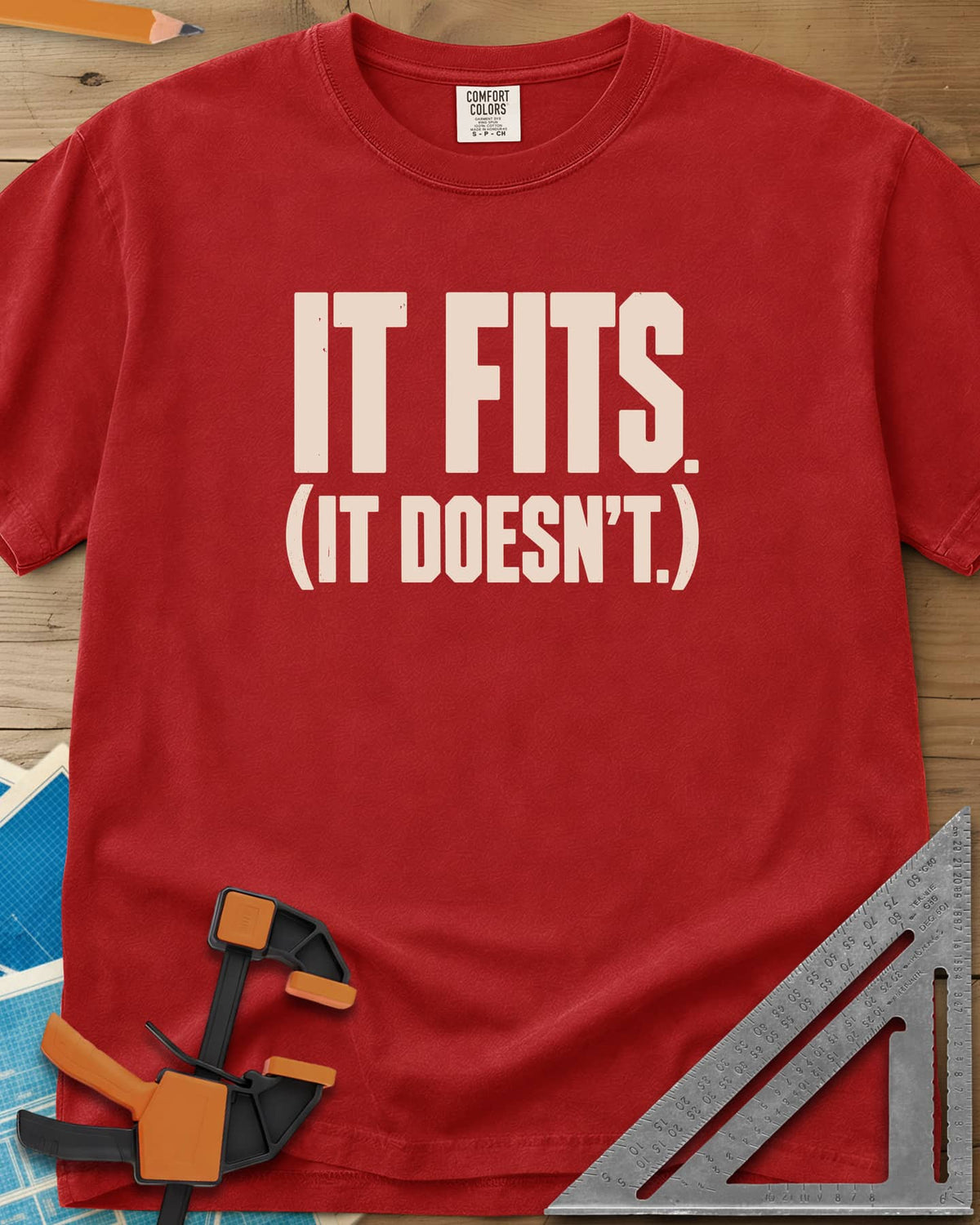 It Fits heavyweight tee in Red, plain bold block lettering with a bracketed second line