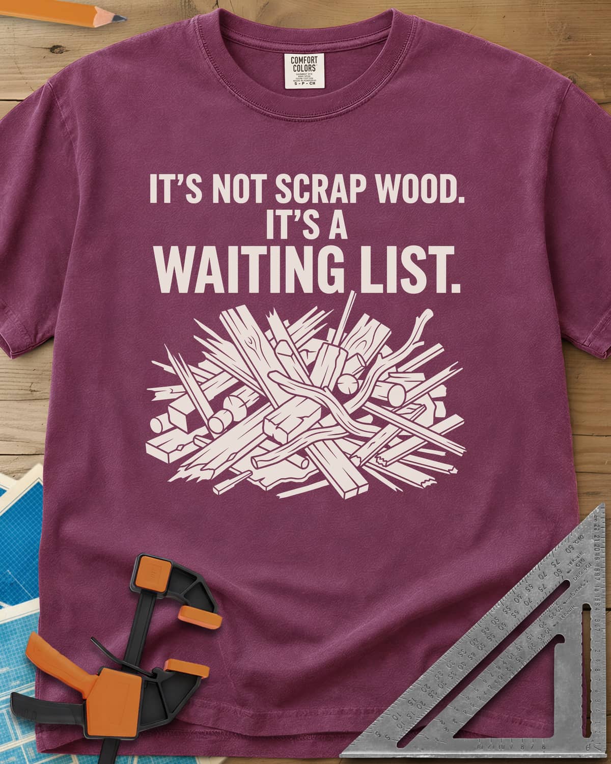 It's A Waiting List heavyweight tee in Berry, a tangled heap of scrap boards, offcuts and branches