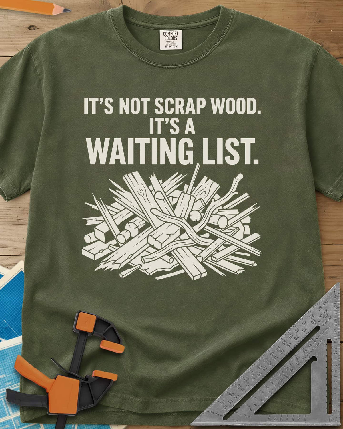 It's A Waiting List heavyweight tee in Hemp, a tangled heap of scrap boards, offcuts and branches