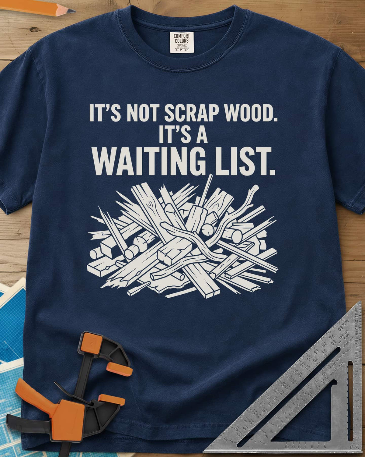 It's A Waiting List heavyweight tee in Navy, a tangled heap of scrap boards, offcuts and branches