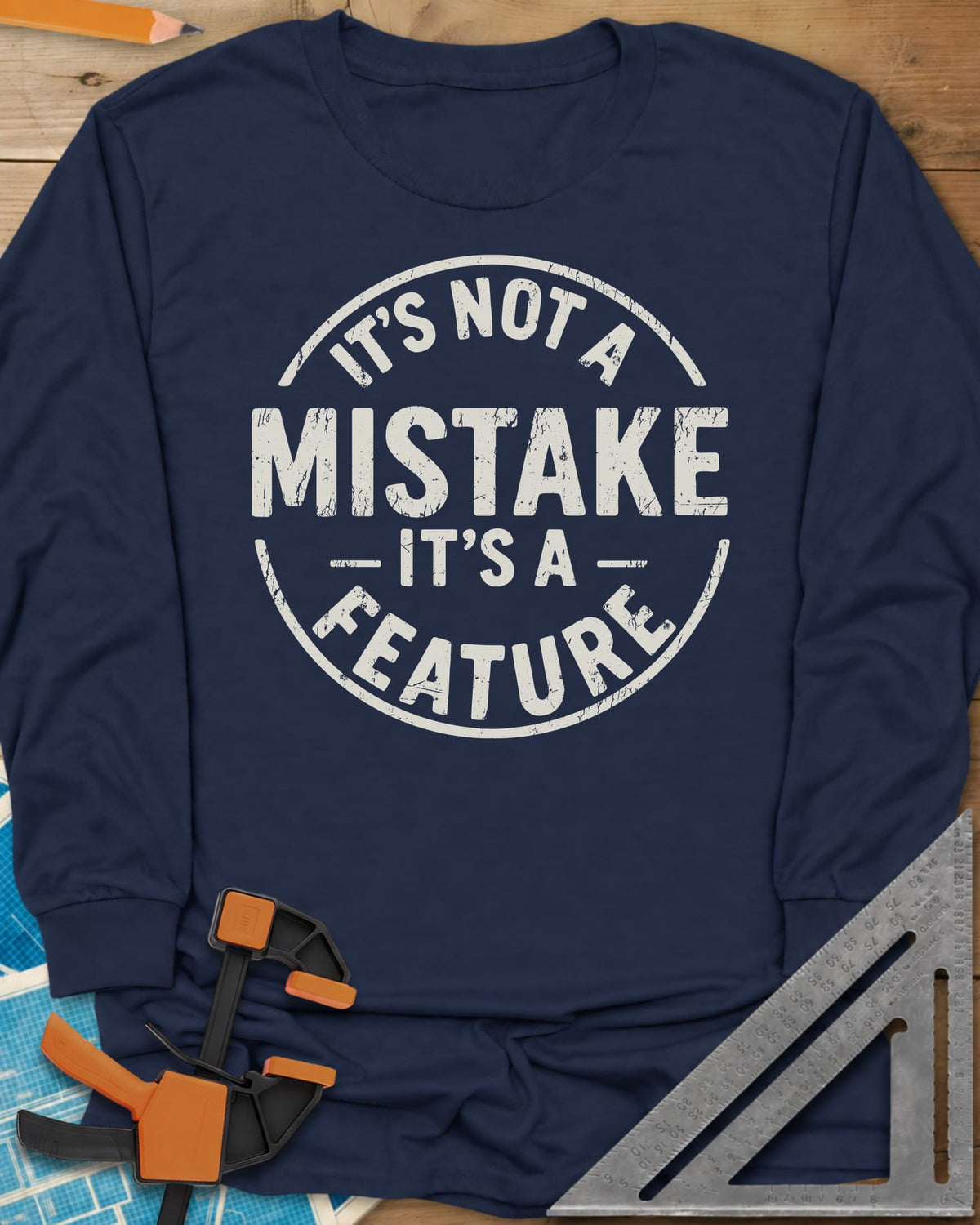 It's Not a Mistake long sleeve shirt in Navy, a worn circular stamp with MISTAKE in large letters at the center