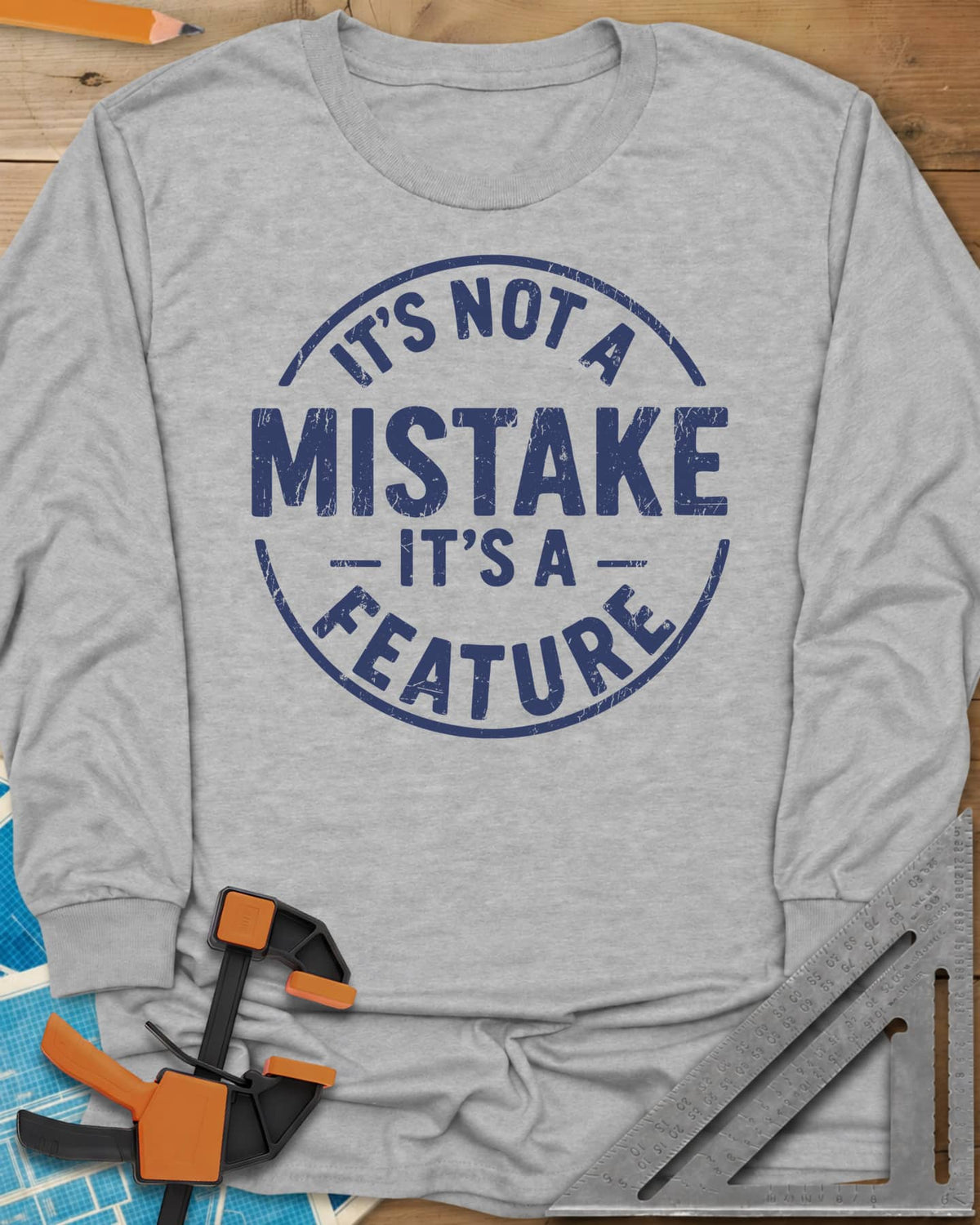 It's Not a Mistake long sleeve shirt in Sport Grey, a worn circular stamp with MISTAKE in large letters at the center