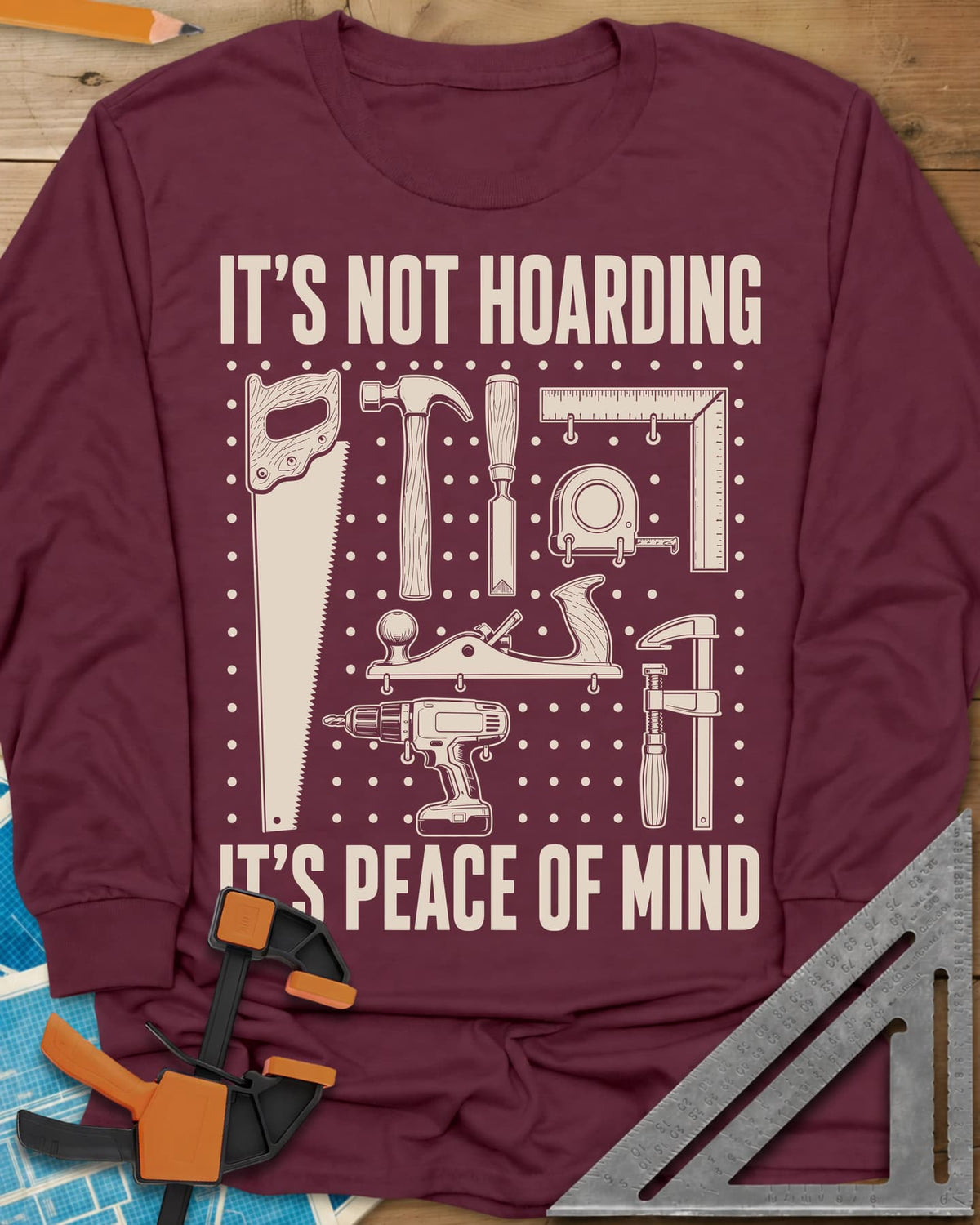 It's Not Hoarding It's Peace Of Mind long sleeve shirt in Maroon, a dotted pegboard grid of hand tools and a cordless drill