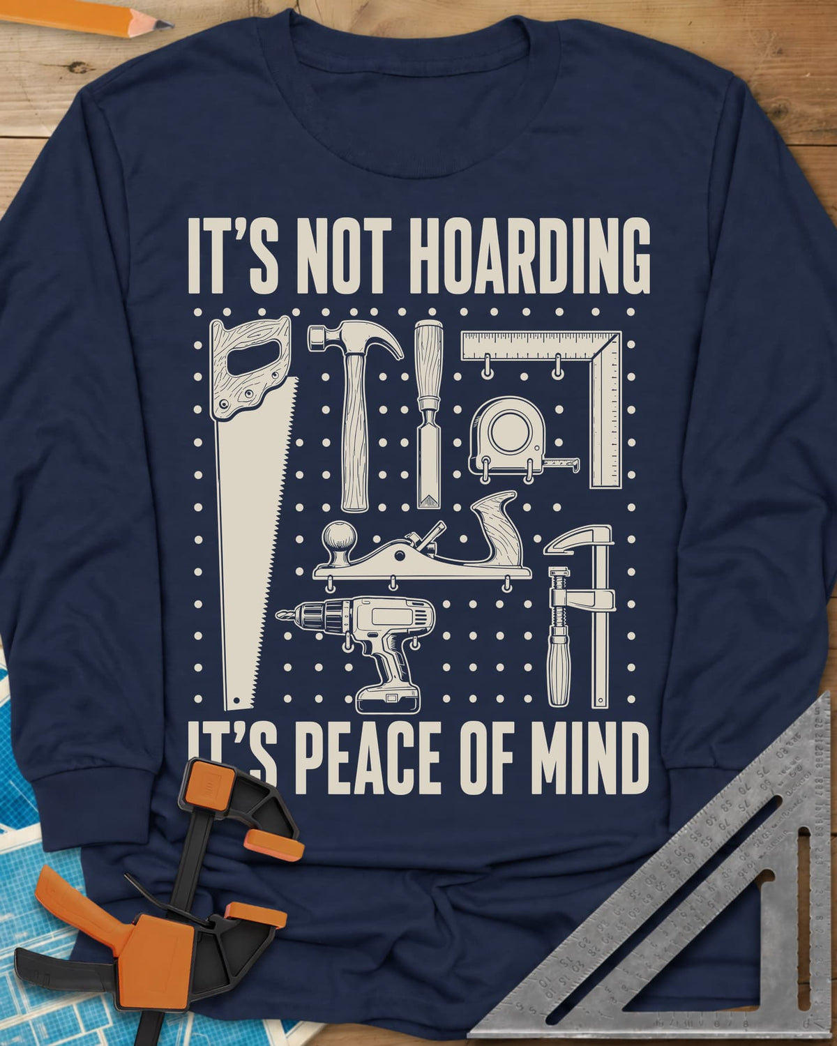 It's Not Hoarding It's Peace Of Mind long sleeve shirt in Navy, a dotted pegboard grid of hand tools and a cordless drill