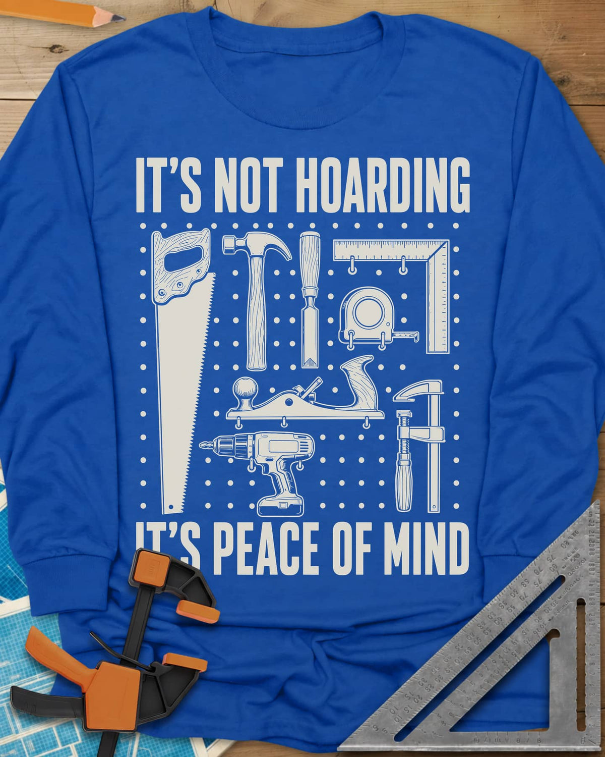 It's Not Hoarding It's Peace Of Mind long sleeve shirt in Royal, a dotted pegboard grid of hand tools and a cordless drill