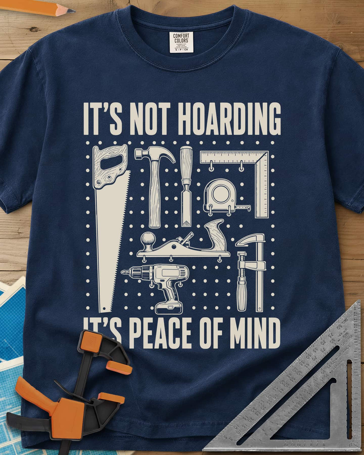 It's Not Hoarding It's Peace Of Mind heavyweight tee in Navy, a dotted pegboard grid of hand tools and a cordless drill