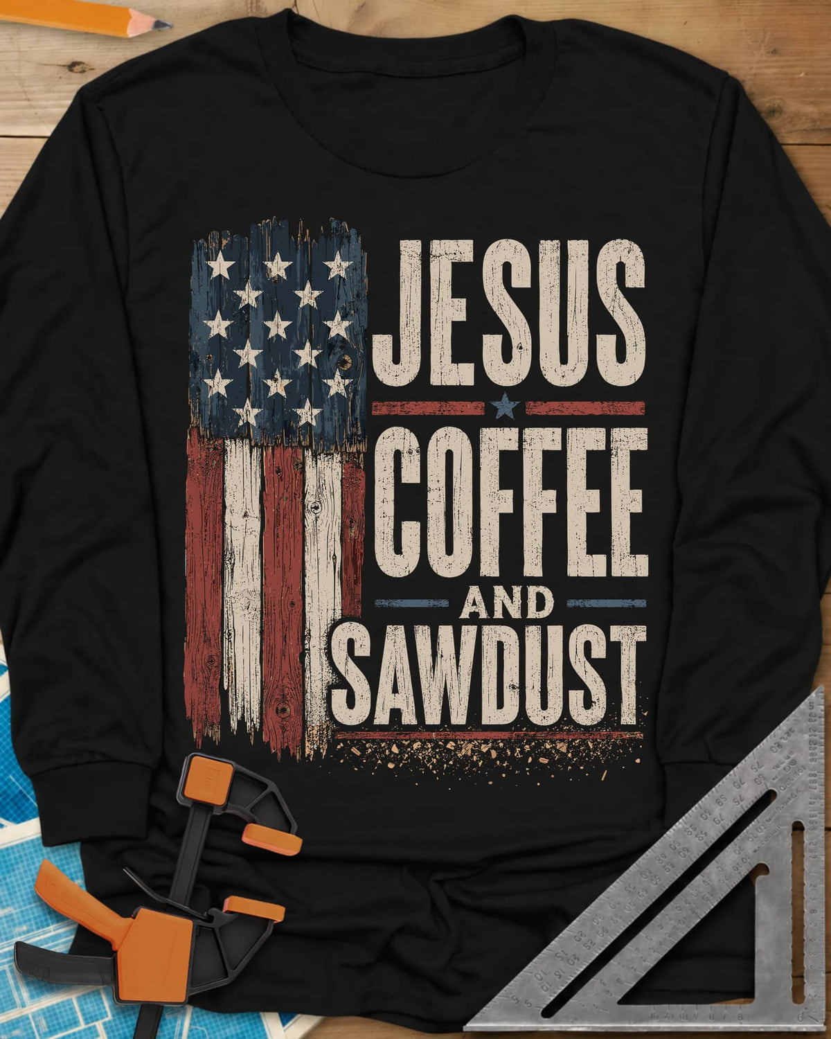 Jesus Coffee Sawdust long sleeve shirt in Black, wood-plank American flag beside stacked distressed lettering