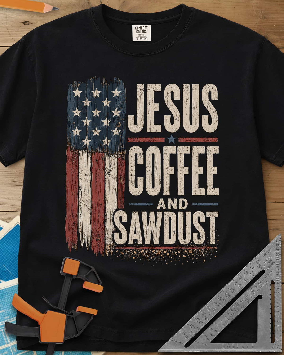 Jesus Coffee Sawdust heavyweight tee in Black, wood-plank American flag beside stacked distressed lettering