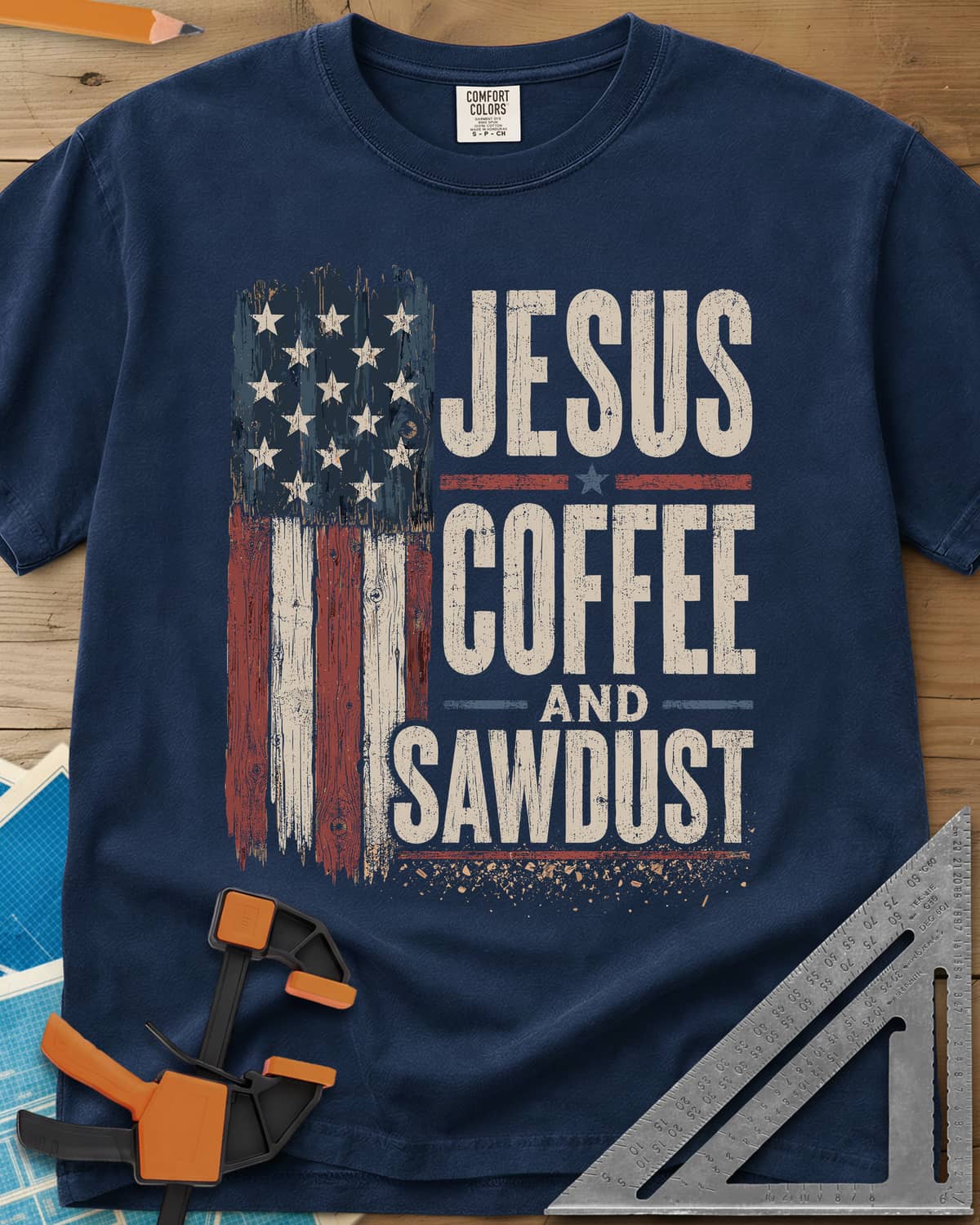 Jesus Coffee Sawdust heavyweight tee in Navy, wood-plank American flag beside stacked distressed lettering