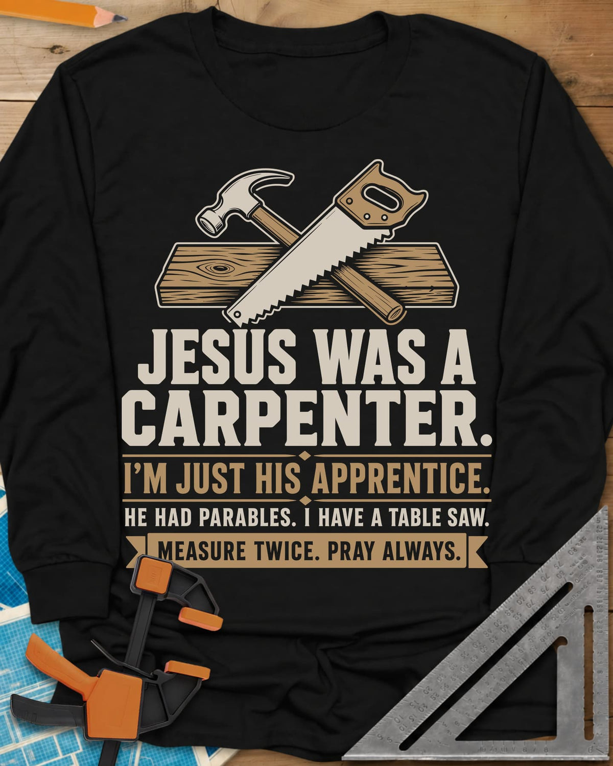 Jesus Was A Carpenter Apprentice long sleeve shirt in Black, crossed hammer and hand saw over a plank, with stacked lettering