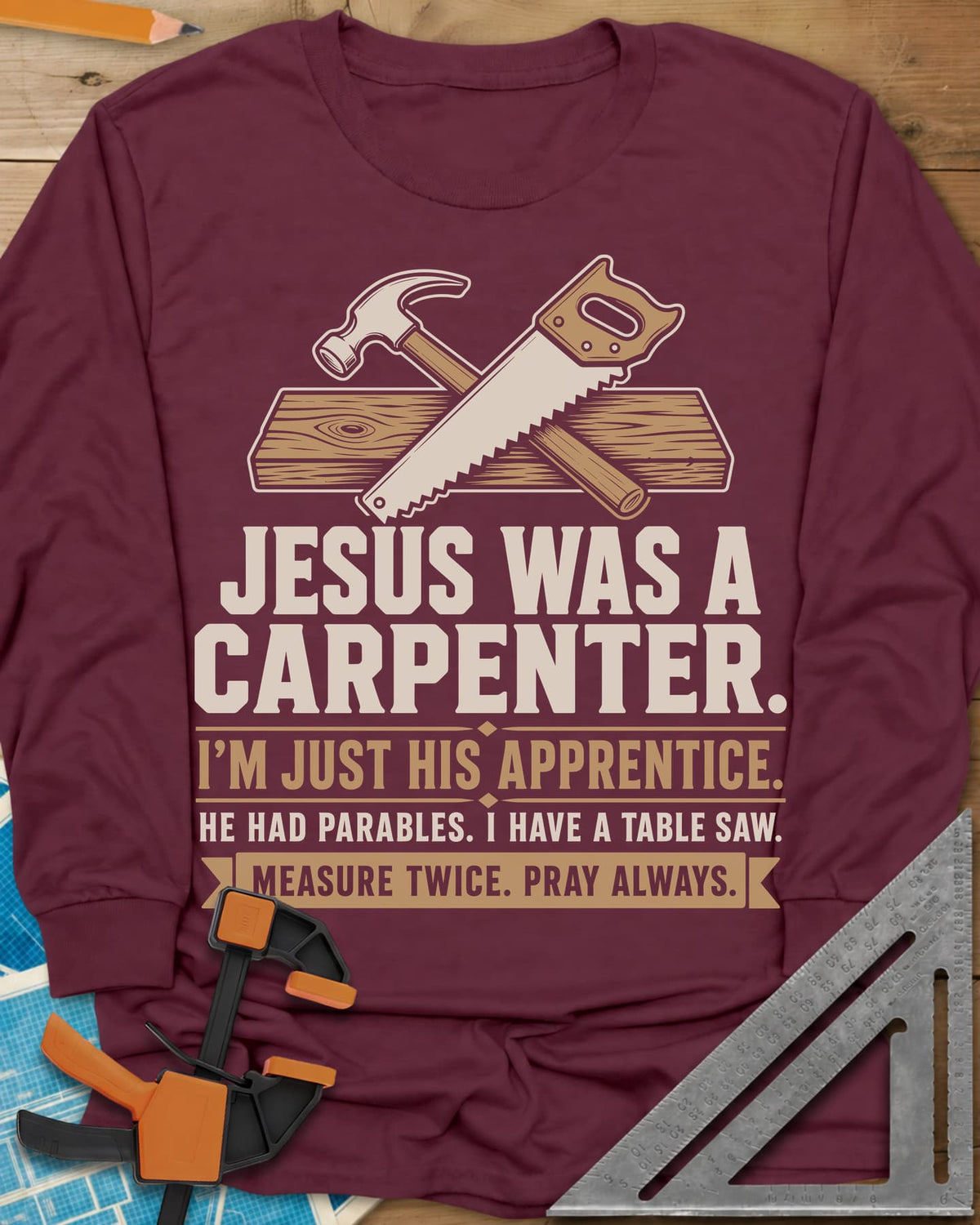 Jesus Was A Carpenter Apprentice long sleeve shirt in Maroon, crossed hammer and hand saw over a plank, with stacked