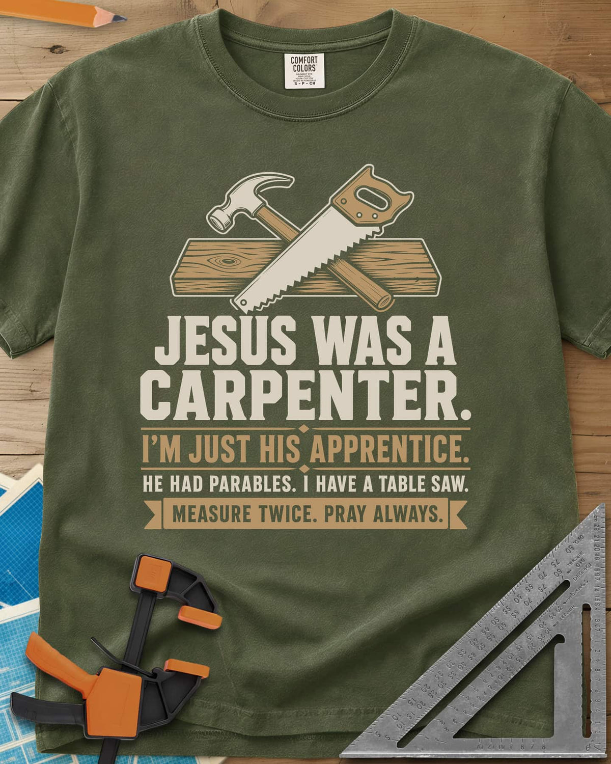 Jesus Was A Carpenter Apprentice heavyweight tee in Hemp, crossed hammer and hand saw over a plank, with stacked lettering