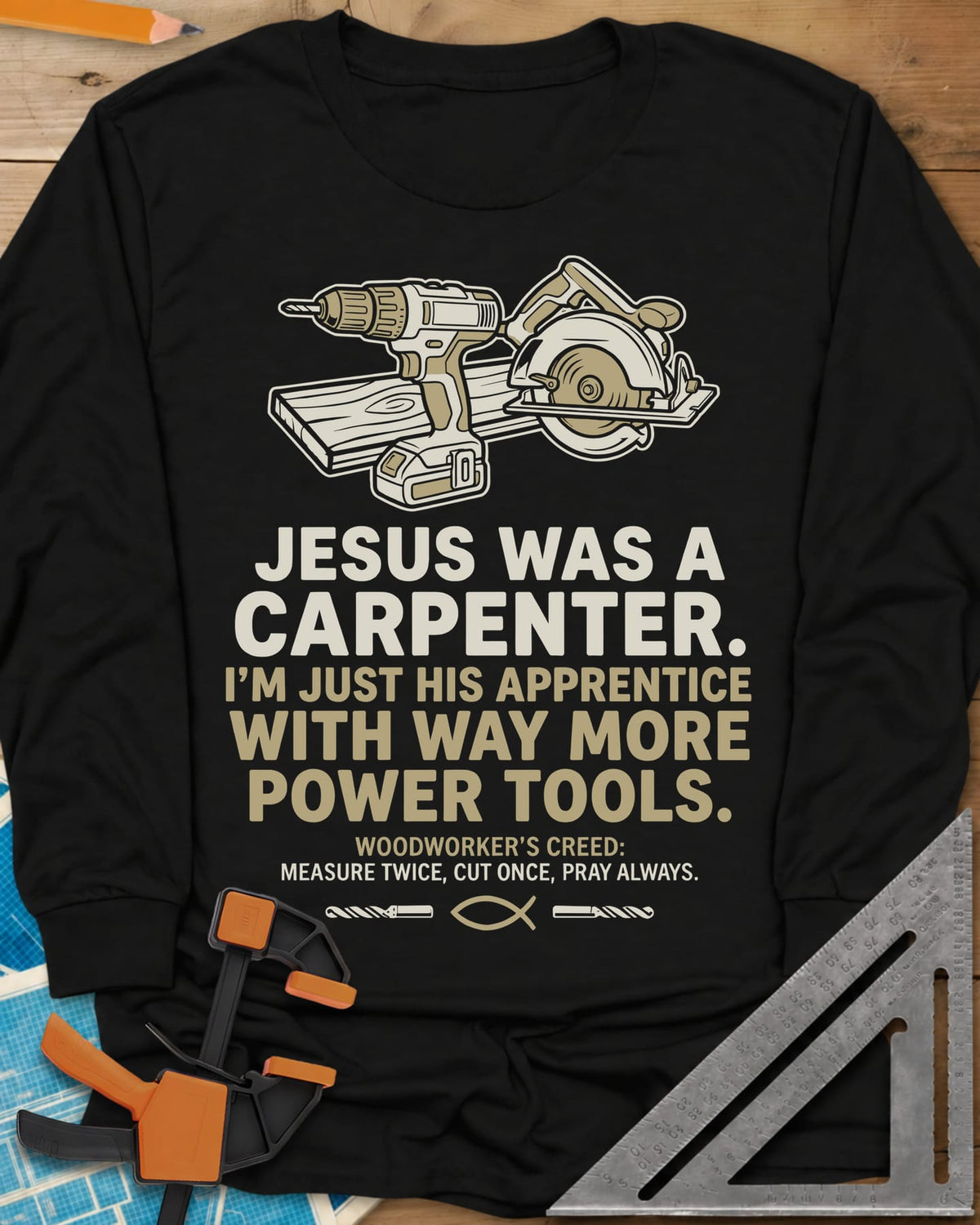 Jesus Was a Carpenter Power Tools long sleeve shirt in Black, a cordless drill and circular saw on a plank, with a fish