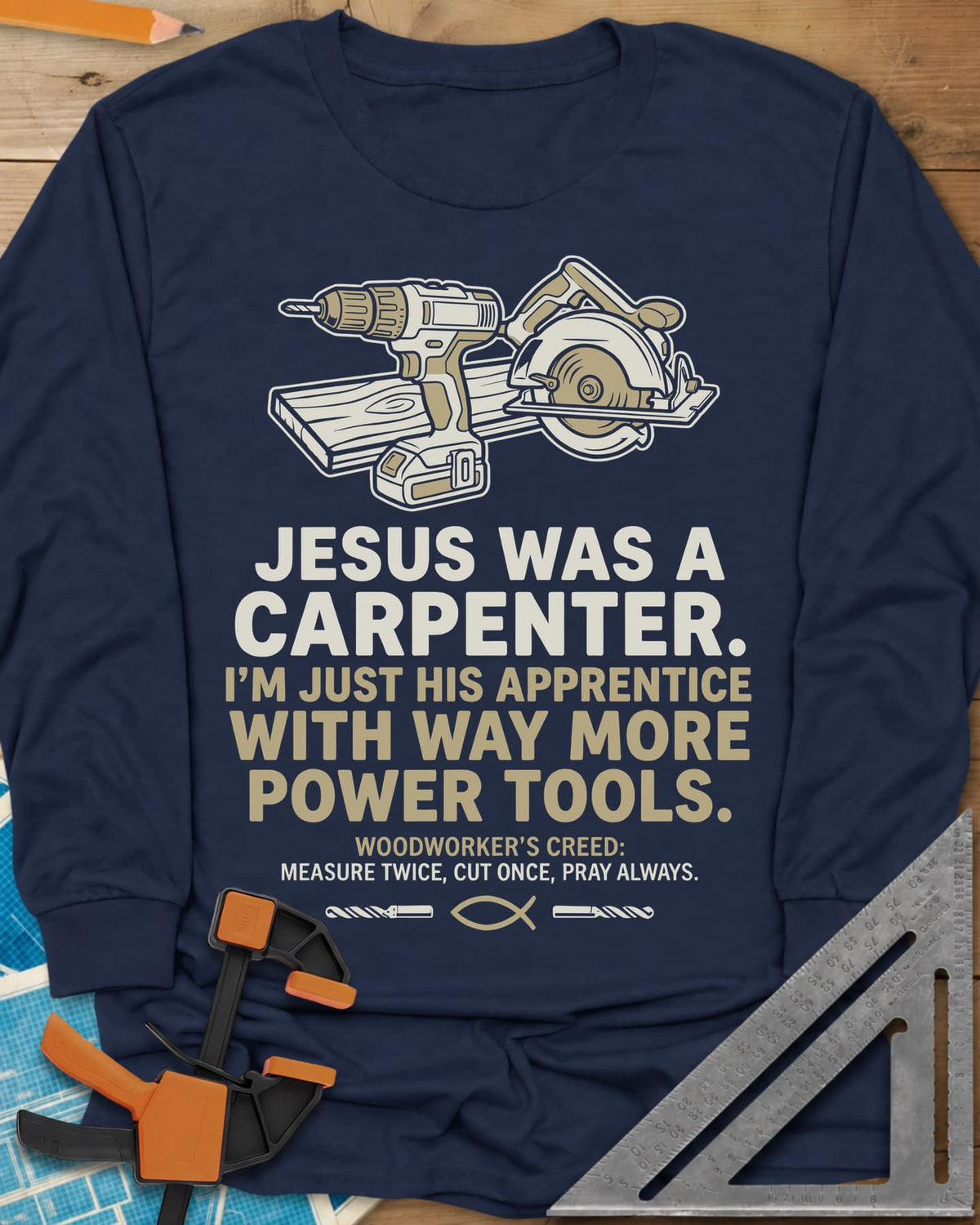 Jesus Was a Carpenter Power Tools long sleeve shirt in Navy, a cordless drill and circular saw on a plank, with a fish symbol