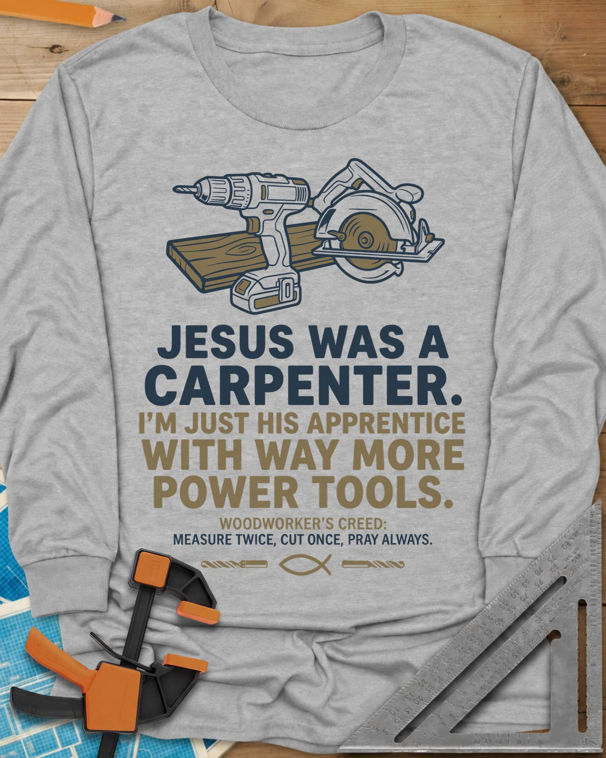 Jesus Was a Carpenter Power Tools long sleeve shirt in Sport Grey, a cordless drill and circular saw on a plank, with a fish