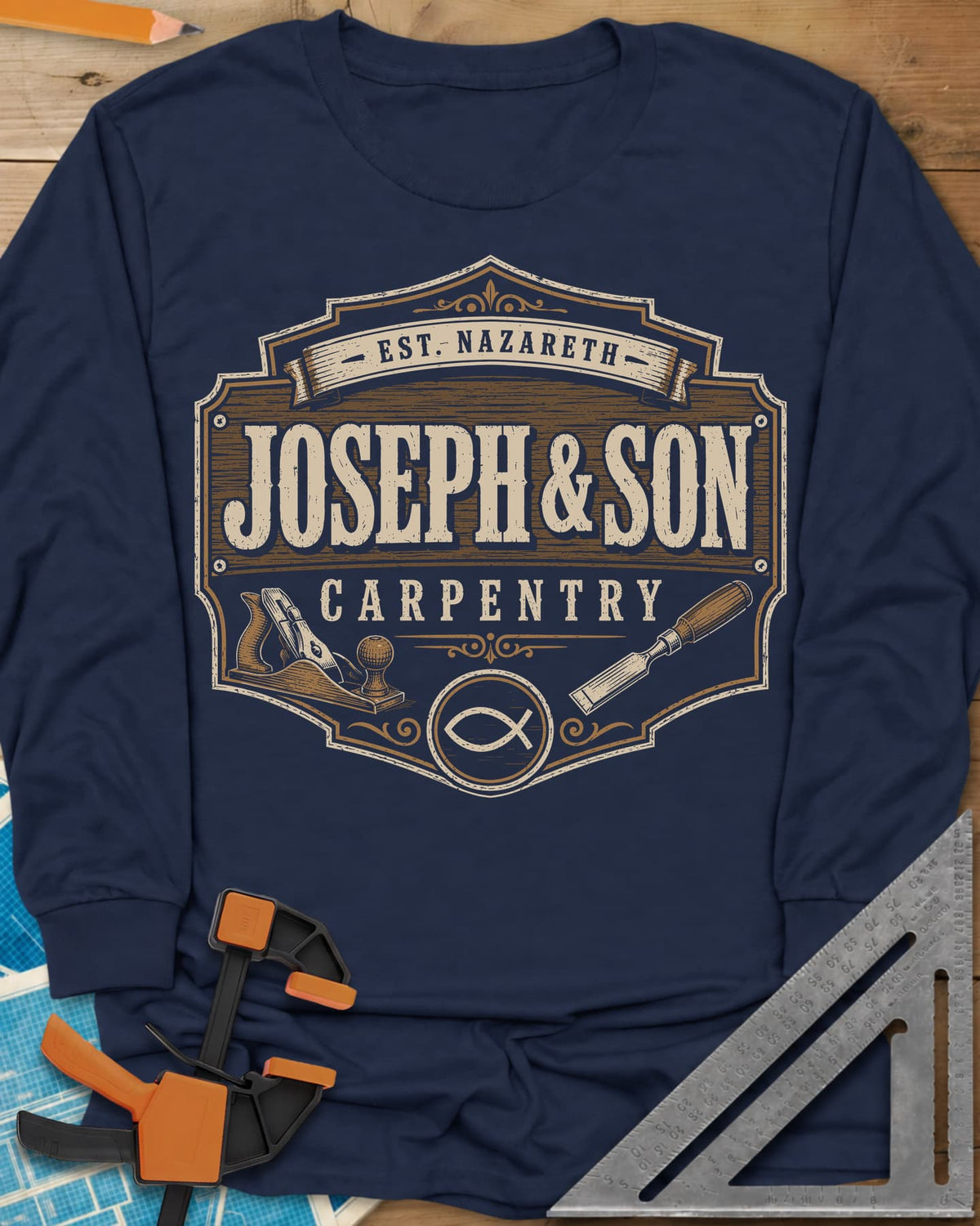 Joseph & Son Carpentry long sleeve shirt in Navy, a shop-sign badge with a hand plane, chisel and fish symbol