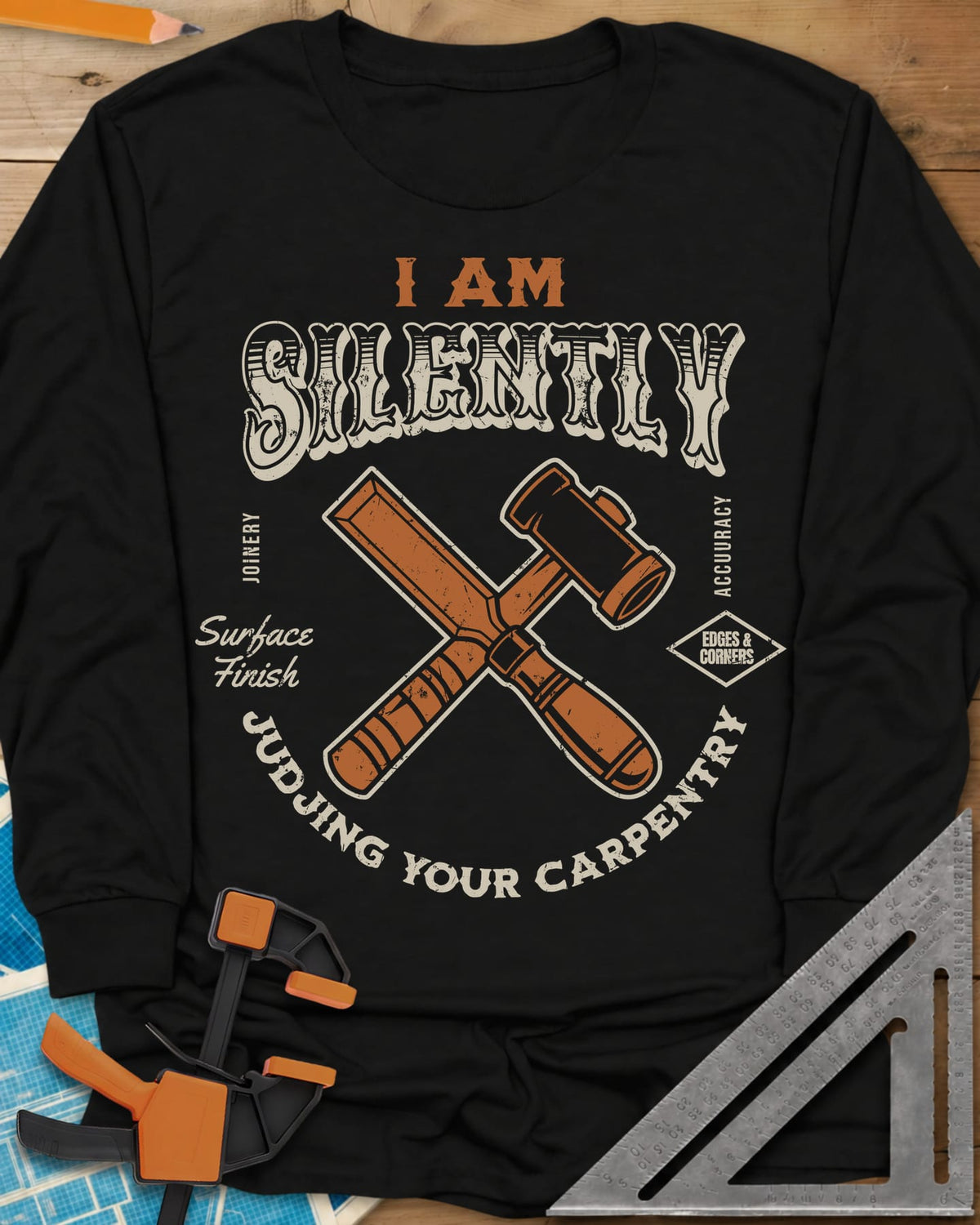 Judjing Your Carpentry long sleeve shirt in Black, a crossed chisel and mallet in a badge with small shop labels