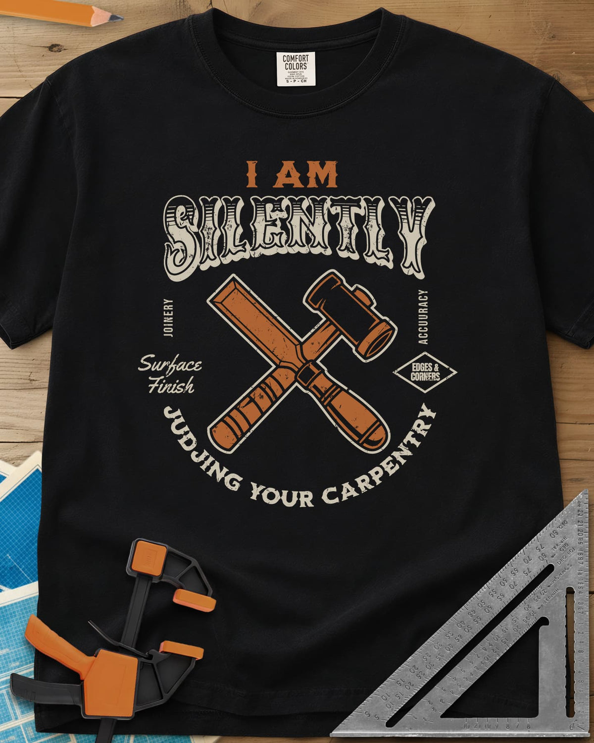 Judjing Your Carpentry heavyweight tee in Black, a crossed chisel and mallet in a badge with small shop labels