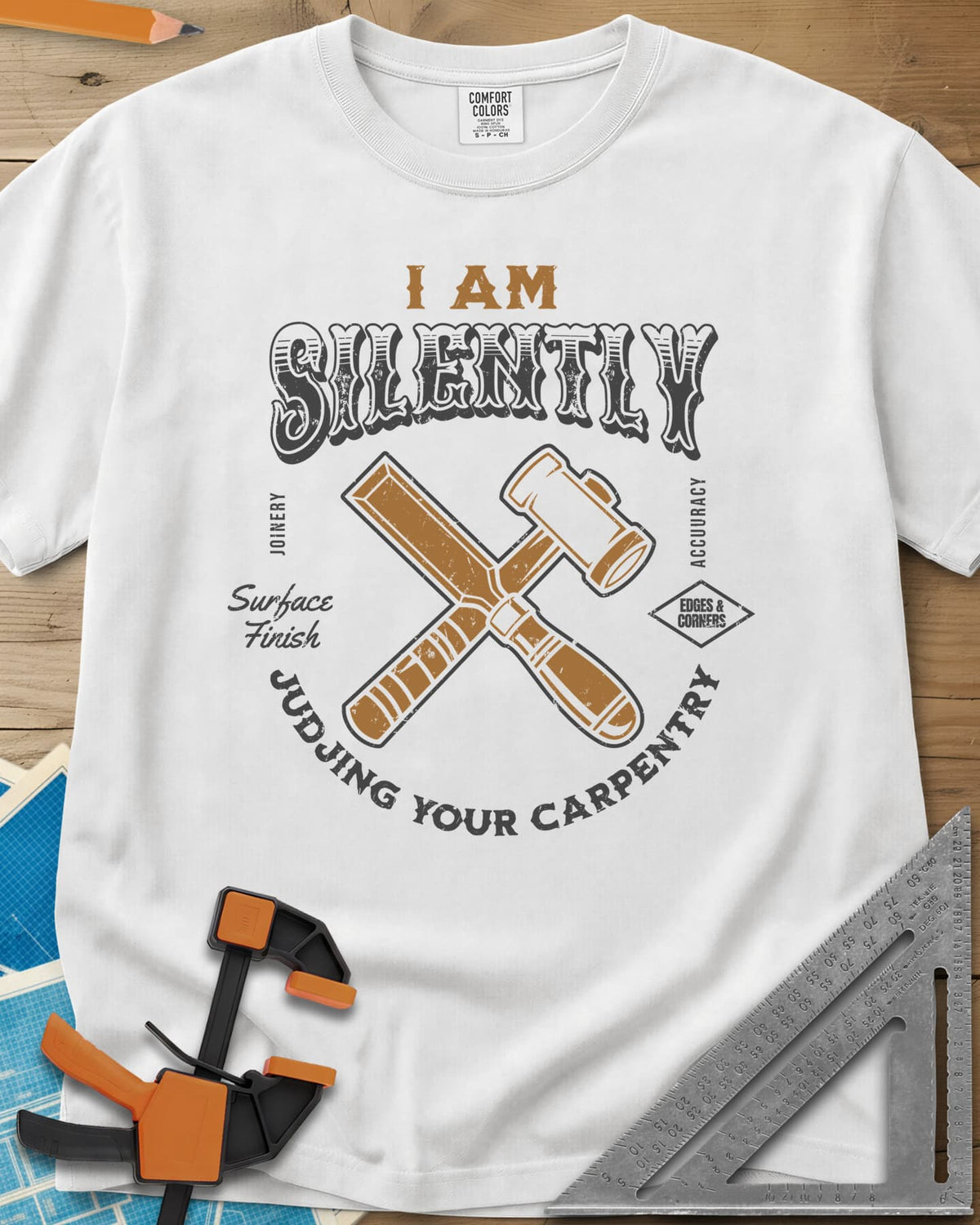 Judjing Your Carpentry heavyweight tee in White, a crossed chisel and mallet in a badge with small shop labels