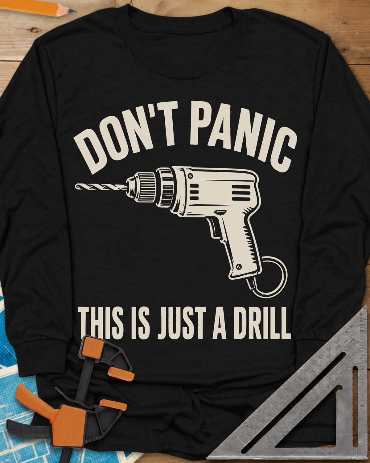 Just A Drill long sleeve shirt in Black, a corded power drill between DON’T PANIC and the punchline