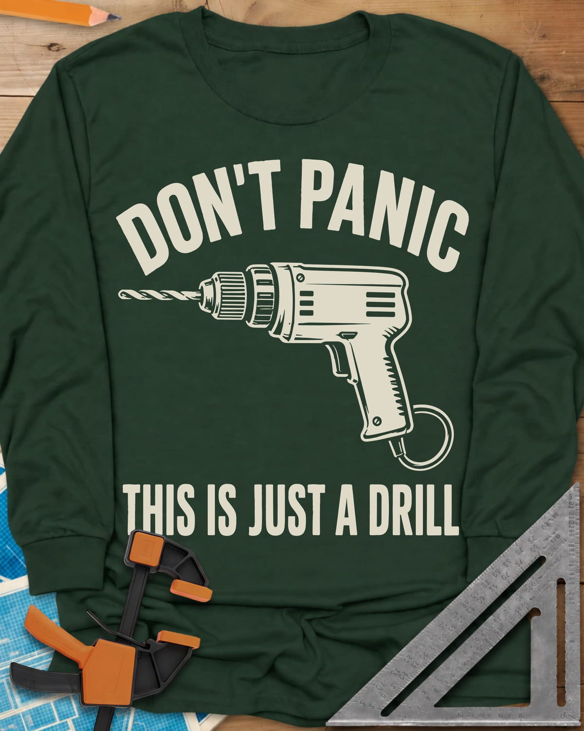 Just A Drill long sleeve shirt in Forest Green, a corded power drill between DON’T PANIC and the punchline