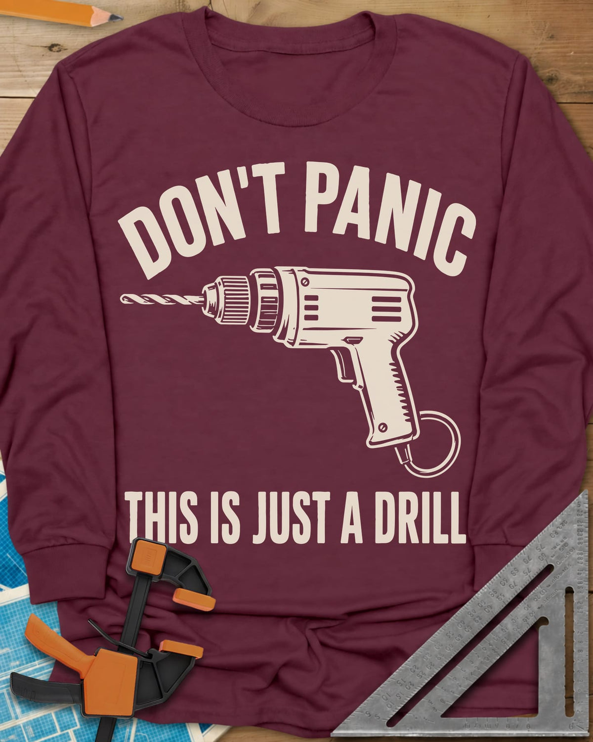 Just A Drill long sleeve shirt in Maroon, a corded power drill between DON’T PANIC and the punchline