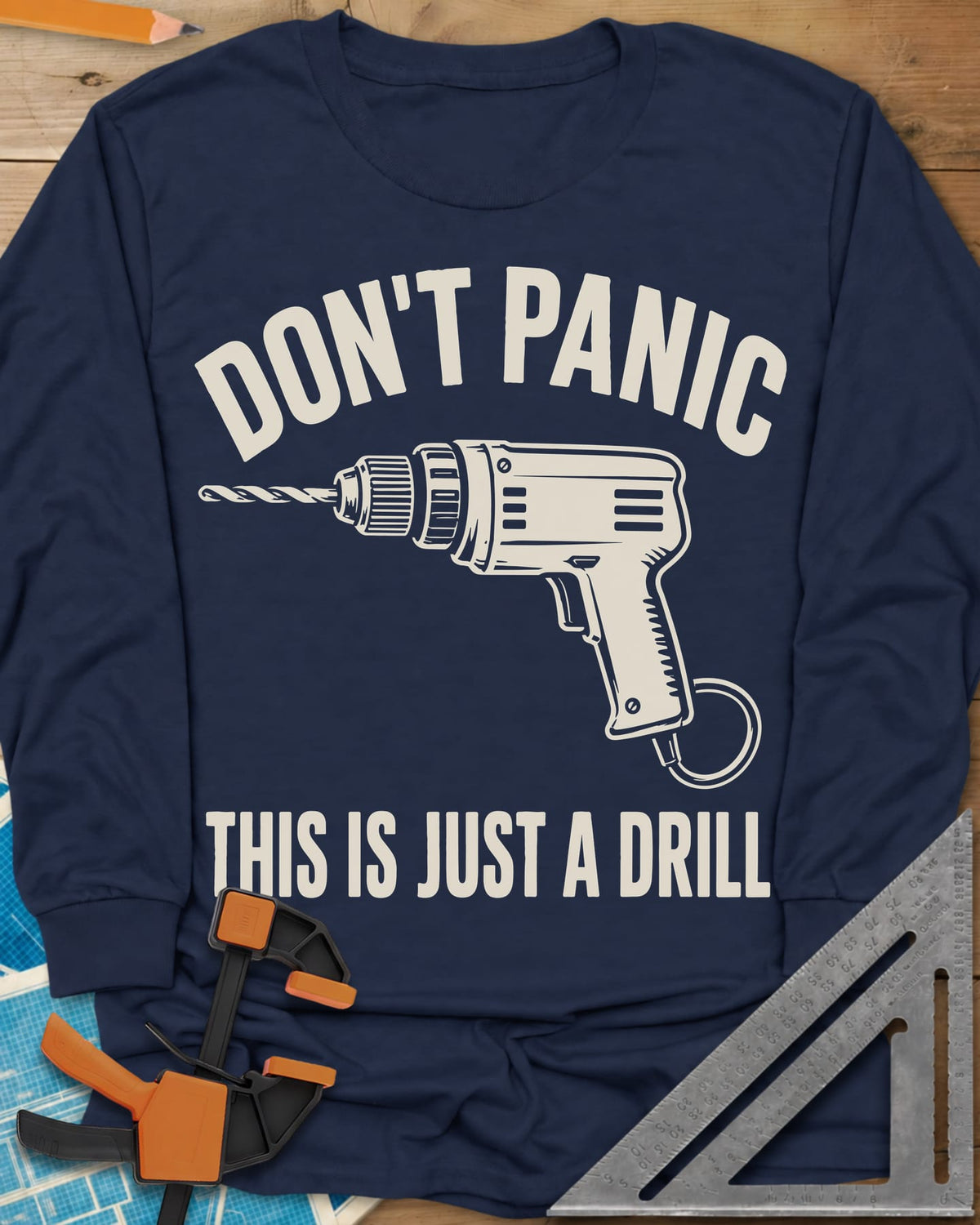 Just A Drill long sleeve shirt in Navy, a corded power drill between DON’T PANIC and the punchline
