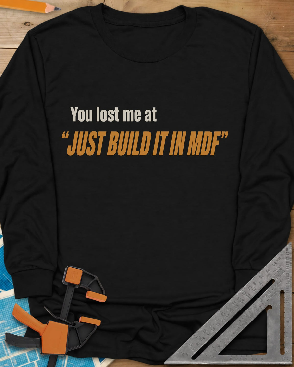 Just Build It In MDF long sleeve shirt in Black, small plain text over bold italic lettering, no graphic