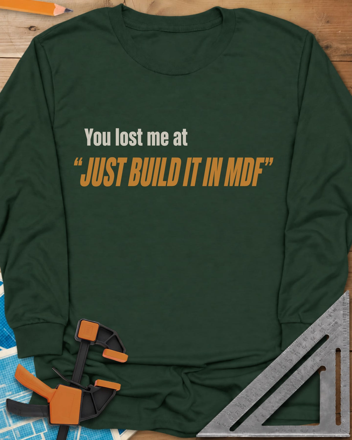 Just Build It In MDF long sleeve shirt in Forest Green, small plain text over bold italic lettering, no graphic
