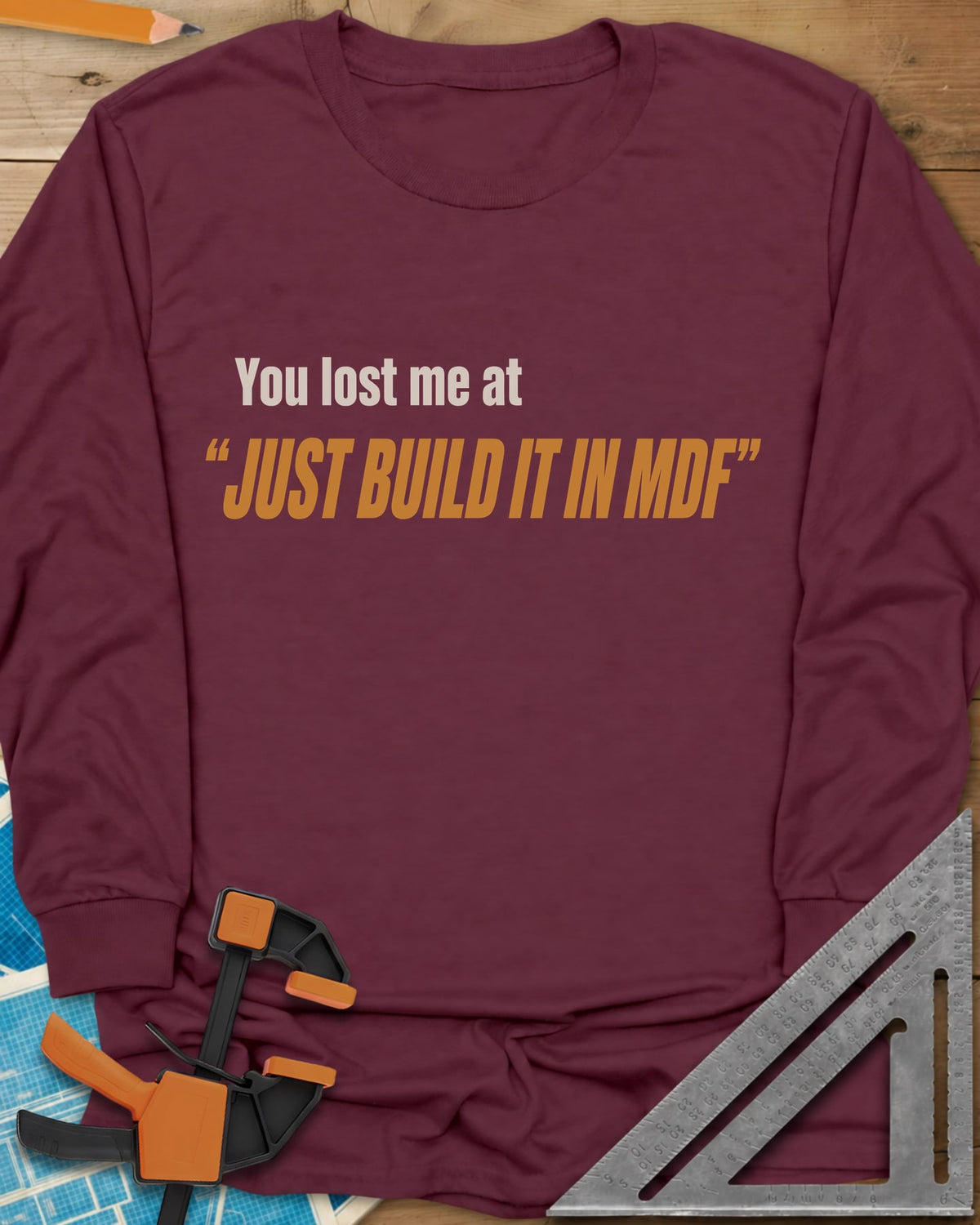 Just Build It In MDF long sleeve shirt in Maroon, small plain text over bold italic lettering, no graphic