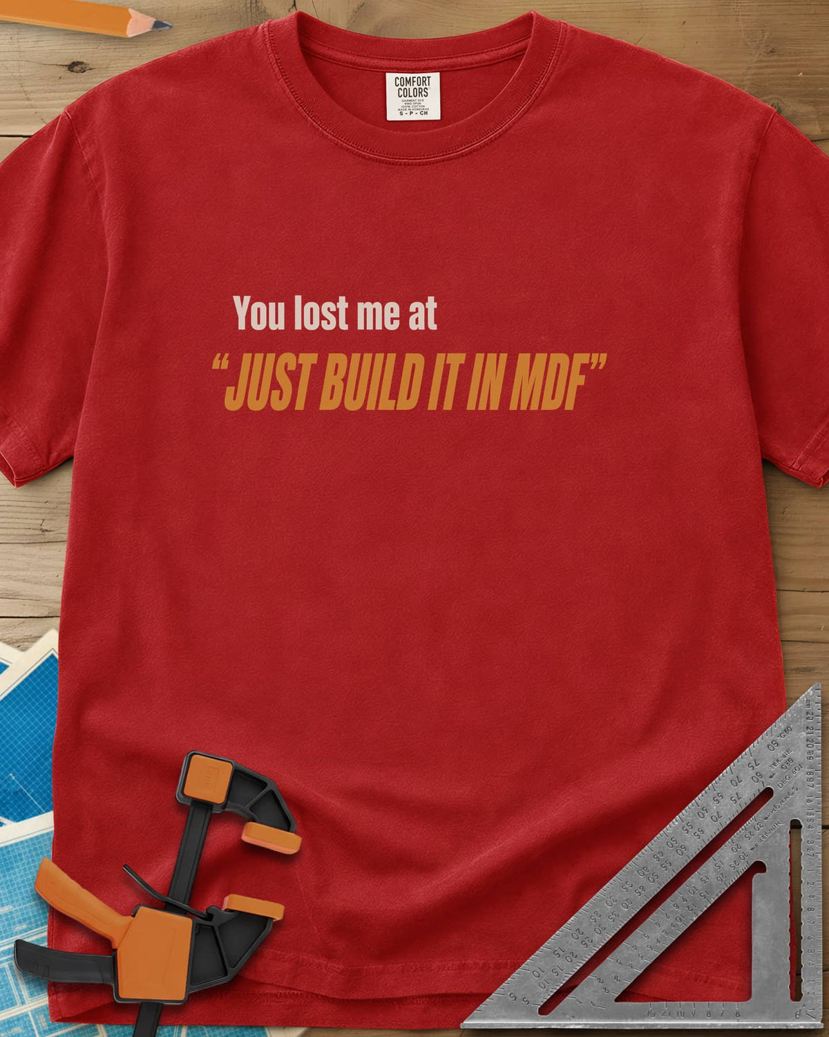 Just Build It In MDF heavyweight tee in Red, small plain text over bold italic lettering, no graphic