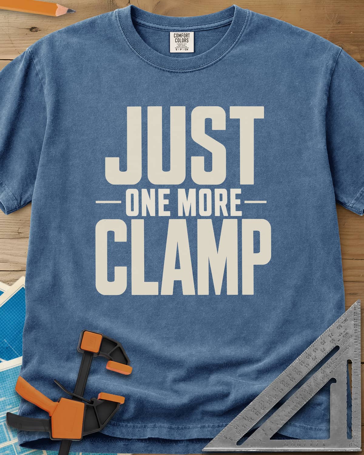 Just One More heavyweight tee in Blue Jean, bold stacked block letters with a thin line divider
