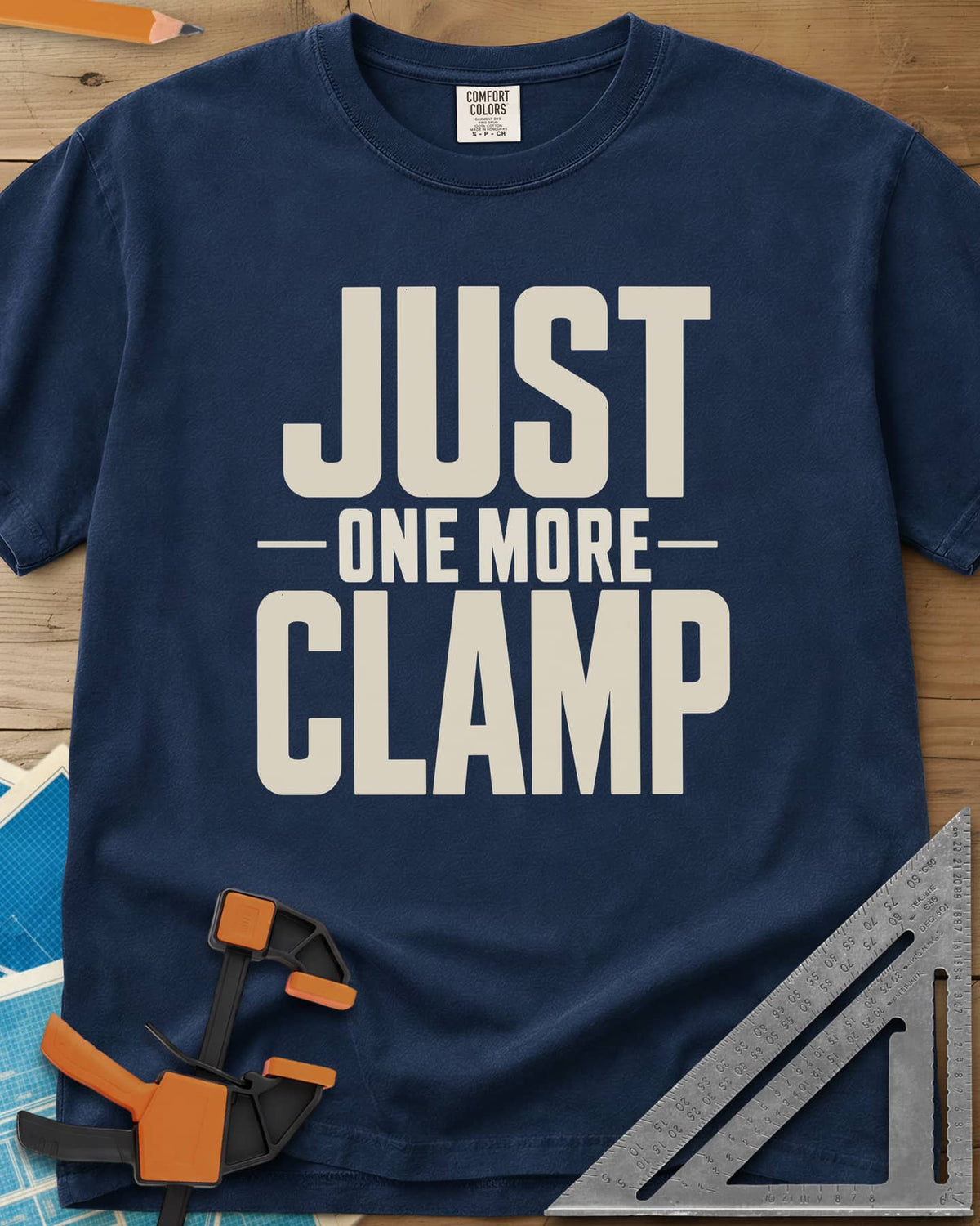 Just One More heavyweight tee in Navy, bold stacked block letters with a thin line divider