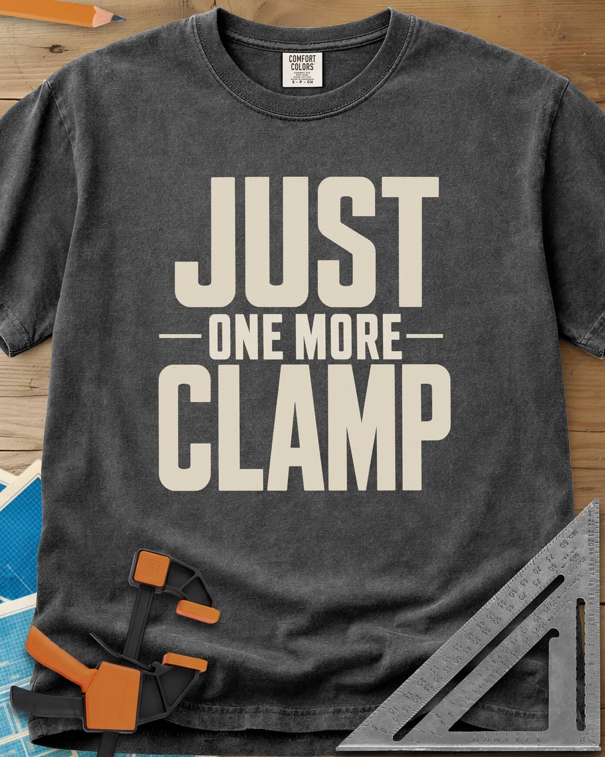 Just One More heavyweight tee in Pepper, bold stacked block letters with a thin line divider