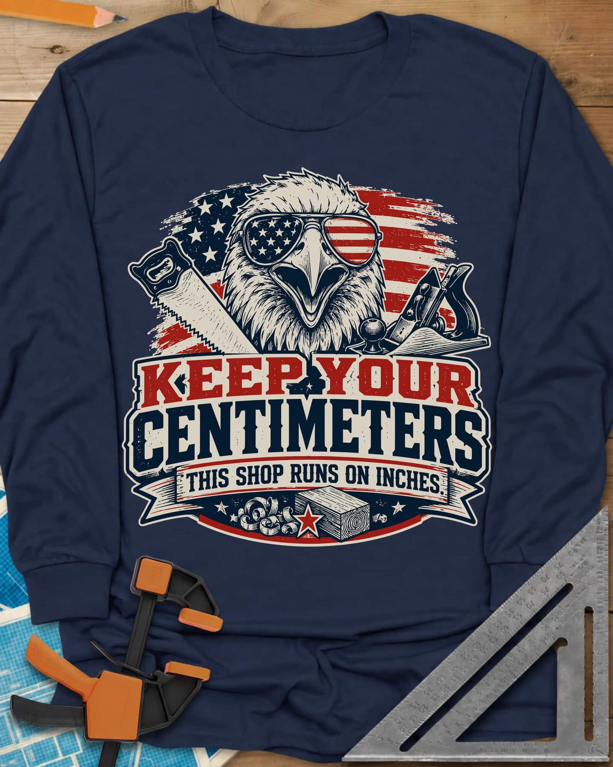 Keep Your Centimeters long sleeve shirt in Navy, an eagle in flag sunglasses with a handsaw, plane and banner