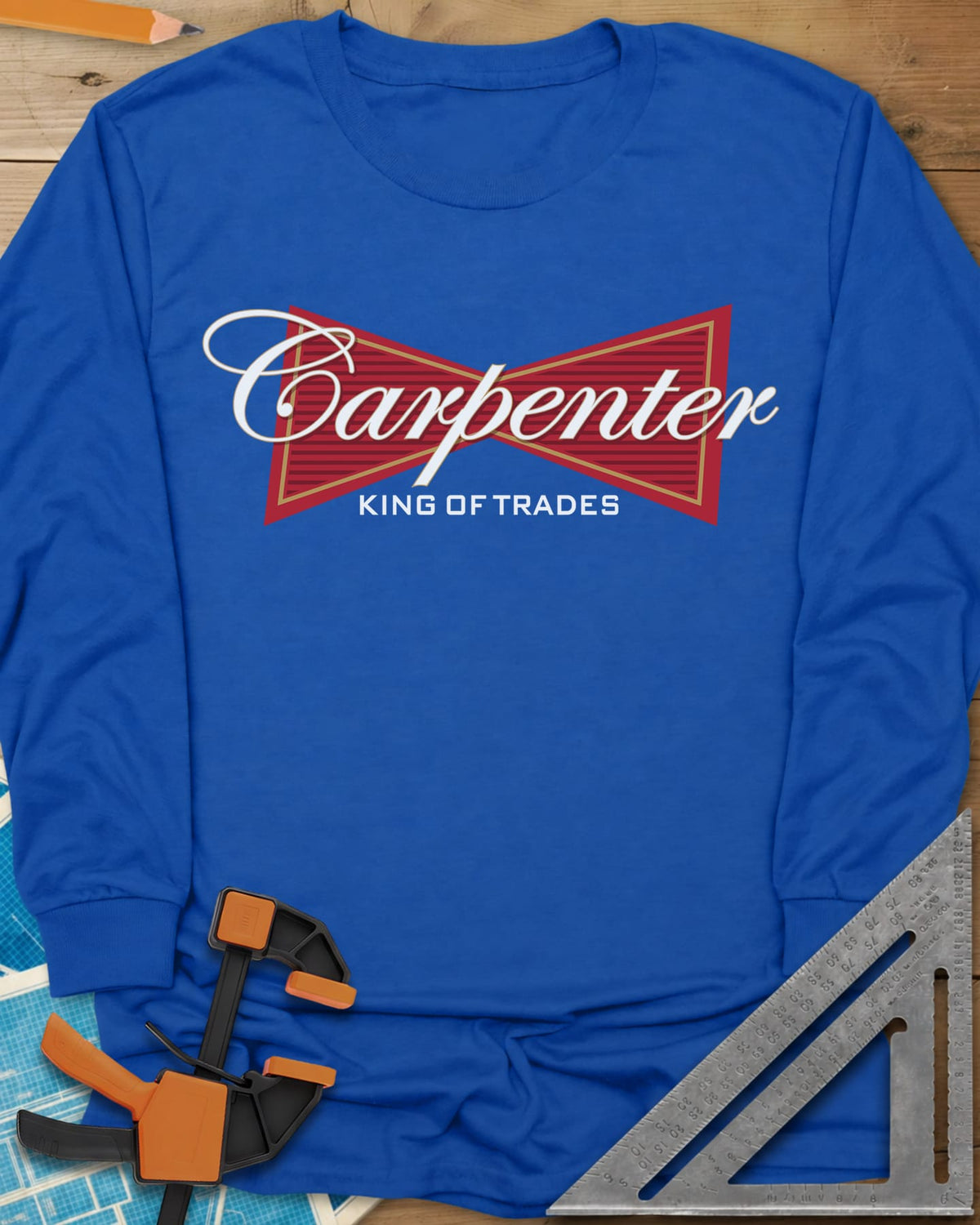 King of Trades long sleeve shirt in Royal, a red bow-tie badge with white script and gold trim