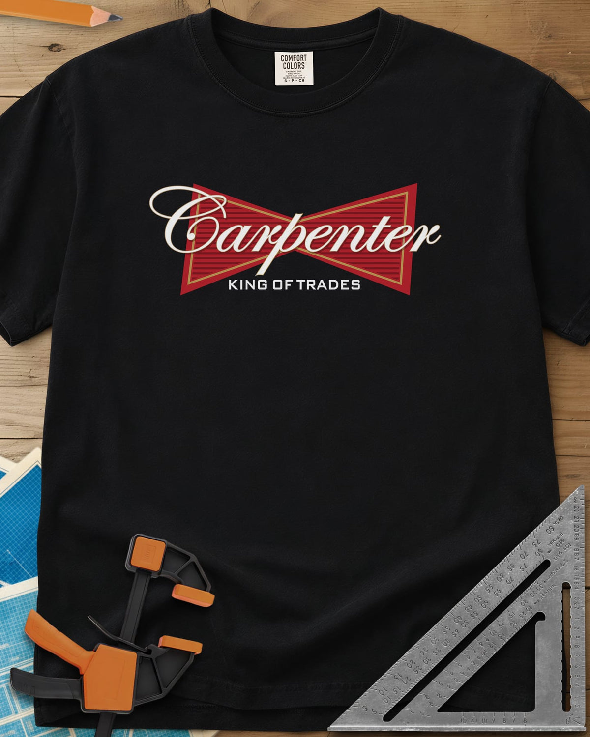 King of Trades heavyweight tee in Black, a red bow-tie badge with white script and gold trim